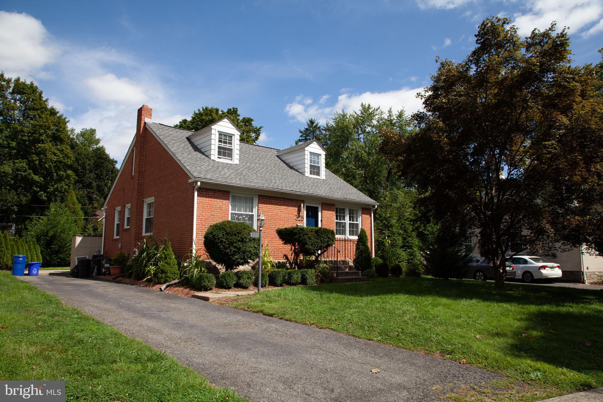 WELCOME to the lovely well-maintained solid brick Cape Cod with beautiful sunny family room addition and beautifully remodelled kitchen (2015)! Newer roof  (2014), updated wiring (2014), newer HVAC (2015), newer patio (2016), freshly painted throughout  (2020),  hardwood floors, newer windows. This very charming home is great for both growing family or downsizing.  Conveniently located to the train (walkable), the town, the college and parks.  Philadelphia Int'l airport, close to I-95 and I-476. Beautifully maintained huge treed backyard  and separate driveway! Schedule a private showing today!