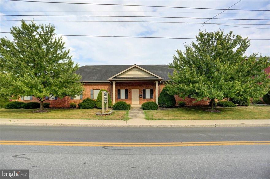 PROFESSIONAL BUILDING!  Real Estate Only, this modern 5,375 sq. ft. one-story brick building was built in 1997 and is in great condition w/35 paved private parking spots!  Approximate 3,800 sq. ft. of the building was Owner occupied by a Physical Therapy business that has dissolved, making the move-in ready space available for new occupant/occupants by 8/31/2024.  Floor plans available.  Engineered trusses make moving walls easy to customize the space.  Ideal for Medical or Professional business!  In addition to 3,800 sq. ft. of owner-occupied space, this building includes approximately 1,500 sq. ft. that is leased to third-party tenant.  Tenant has been there since at least 2015. INVESTORS--take a look!  One long term tenant already in place and 3,800 sq. ft. of professional space available to rent--the numbers should provide a good ROI w/a modern building & private parking, it's a great opportunity!