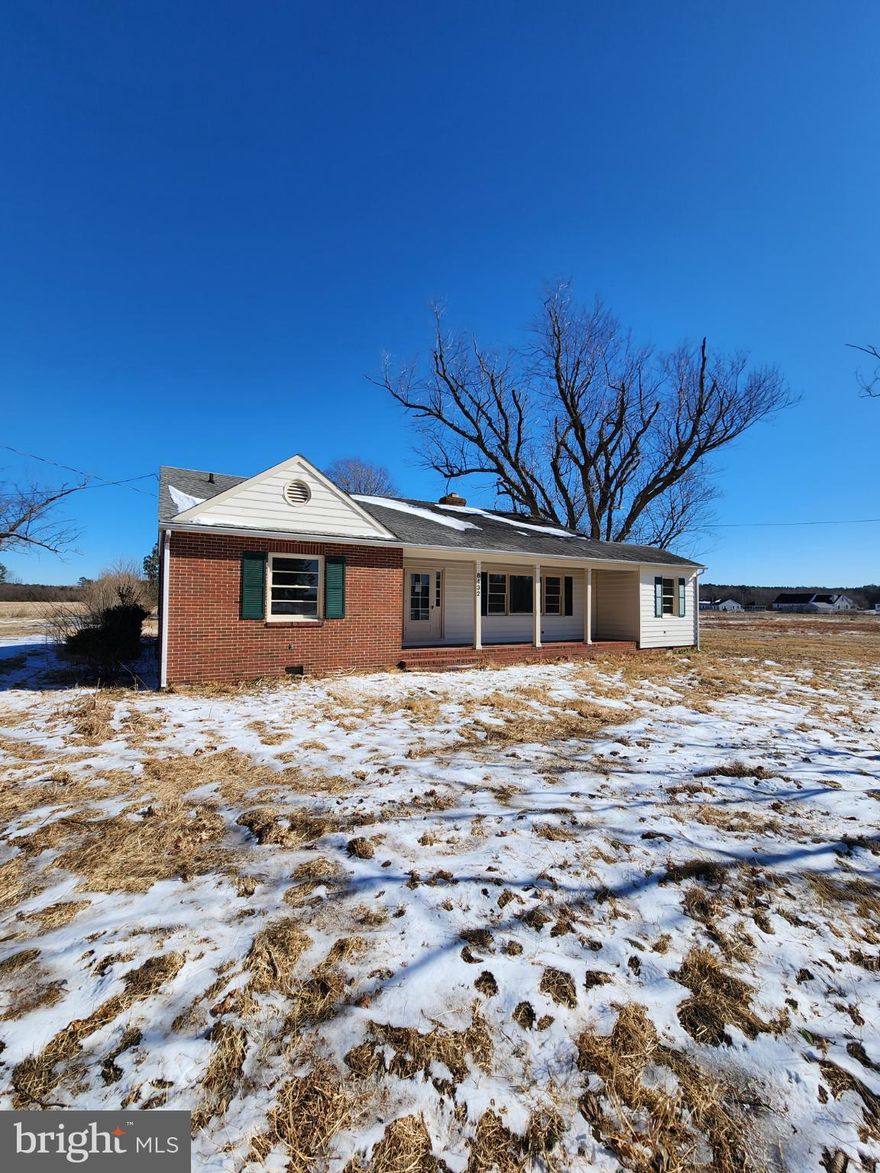 Discover the charm of this beautifully updated ranch-style home, nestled on a generous 3.64-acre lot, offering a perfect blend of comfort and functionality. Step inside to find a warm and inviting interior featuring elegant crown moldings and chair railings that add a touch of sophistication. The spacious dining area is perfect for gatherings, while the cozy living room, complete with a brick fireplace, creates an ideal setting for relaxation. This home boasts three well-appointed bedrooms, including an entry-level option for convenience. The kitchen is equipped with modern stainless steel appliances, including a built-in microwave, gas oven/range, and dishwasher, making meal prep a delight. Enjoy the ease of laundry with dedicated hookups, ensuring your home remains organized and efficient. Outside, the expansive lot offers endless possibilities. With unrestricted space, you can create your own outdoor oasis, whether it's a garden, play area, or simply a serene retreat. The detached garage and additional shed shop provide ample storage and workspace. This property is not just a house; it's a place where memories are made. Embrace the opportunity to make it your own and enjoy the tranquility of country living while being just a short drive from local amenities. Your future home awaits!