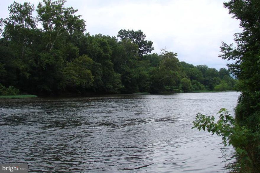 High Bank River frontage on the beautiful Shenandoah River . Raw land .55 of an acre . Corners marked by survey . Wooded  lot  zoned Residential .
