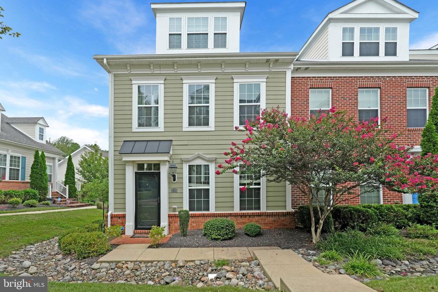 Welcome home to The Village at Steeple Chase! This gorgeous and modern end-unit townhome boasts primary bedroom suites on all three levels!  On the main level of the home you’ll discover an open floorplan with high ceilings and gleaming hardwood floors. Large windows flood the living space with natural light, making the home bright and airy. The spacious gourmet kitchen features stainless steel appliances, sleek granite countertops, and a classic tile backsplash. Pull up a stool to the oversized kitchen island bar or enjoy an intimate meal in the adjacent dining area. This open concept is ideal for entertaining friends and family! On the front of the home you’ll find the first of three bedroom suites, with a large walk-in closet, ceiling fan, and plush carpeted floors. The en suite full bathroom includes a wide double sink vanity.  Upstairs on the top level of the home, the light-filled second bedroom suite features a bump-out for a quiet sitting room, and a tasteful attached full bathroom. Downstairs on the entrance level, you’ll find the third bedroom suite, with a ceiling fan and its own private full bathroom. Step outside onto your deck to sip your morning coffee in peace, or enjoy the beautiful common grounds and abundance of amenities offered within the community. The outdoor pool, club house, trails, and playground are ready for your enjoyment. With a two-car garage and driveway on the back of the home, you’ll have plenty of room for storage and parking. Minutes to Safeway, Weis Markets, Walmart, La Plata Plaza, St Charles Towne Plaza, The Charles Restaurant and Market, Marie’s Diner, Charles Street Bakery, Clark Run Nature Area, Laurel Springs Regional Park and Trail, and UM Charles Regional Medical Center. Quick access to Crain Highway, Port Tobacco Road, Leonardtown Road, and Indian Head Highway. Schedule a private tour of your stunning new home today!