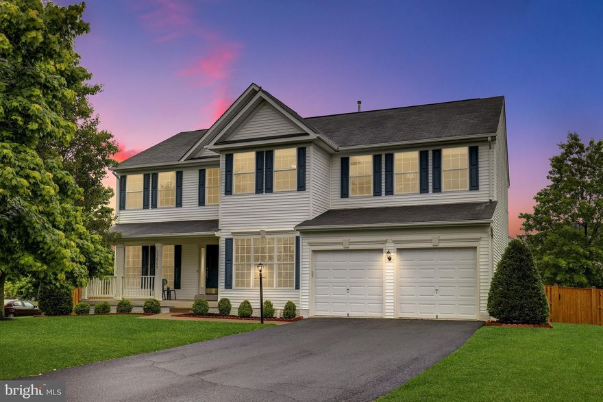 You will love this spacious Richmond American Waterford colonial model in fantastic condition.  Relax on the covered front porch while getting to know your neighbors.  The home offers a desirable open concept floor plan for clear sight lines from the kitchen through to the family room. Gleaming wood floors reflect the abundant natural light pouring into this home, and brand new carpet on the main level provides years of durability. The main floor office and family room are wired for surround sound.  The kitchen offers upgraded, no-maintenance Silestone kitchen counters! You will love the new gas cooktop  as well as a large island for entertaining, a spacious eating area, and an atrium door to the back deck. The back yard is fenced for privacy creating a large space for pets or kiddos to roam. A main level office provide great utility for telecommuting efficiently, and the basement is finished with an exit to the rear.  Dual zone HVAC will allow for your comfort throughout the home year round. The fully finished walkout basement has a full bathroom.   Great location near Bristow amenities and shopping.