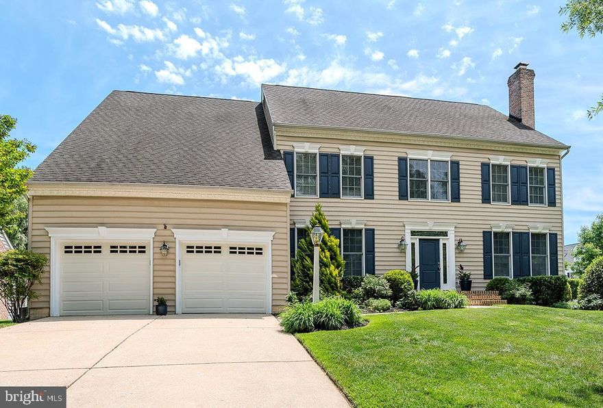 Nestled on a lovely corner lot, this Koch Colonial-style residence exudes timeless elegance and modern comfort in the much sought after St Margaret's Landing Community.   The home has 4 BR plus a Library/Office.   The home, built in 2001,  boasts over 5,600 square feet of finished living space, perfect for both entertaining and everyday living. Step inside to discover a warm and inviting interior with a two story, light filled entryway, where luxury meets functionality.   The traditional floor plan features a stunning double staircase which splits to allow access to the front or the back and gracefully connects the main living areas- with wood flooring throughout the main level. The front Living Area, complete with a cozy gas fireplace invites you to sit with friends or snuggle up and enjoy a good book.  Continue into the home and the large Den boasts built in shelves and cabinets , and a Wood Burning Fireplace while flowing seamlessly into the gourmet kitchen, which is a chef's dream. Outfitted with stainless steel appliances, including a double oven and a down-draft cooktop, the kitchen also features an expansive island, quartz countertops, tile backsplash and a spacious pantry. An eat-in area provides a perfect spot for casual meals, while the formal dining room sets the stage for elegant gatherings.  Down the hallway, and off the beaten path, are the Library/Office with built in shelving and a large Bay Window and the Powder Room.  There are  two large coat closets on this level as well as the Laundry Room.  On the Upper Level, Retreat to the grand Primary Suite, a true sanctuary, featuring two walk-in closets, a dressing area and a spa-like, updated bathroom equipped with a soaking tub and a walk-in shower. Each of the additional three bedrooms is generously sized, two with walk-in closets, ensuring adequate space for all. The fully finished basement offers versatile space for an entertainment/gaming/work out area with your 3rd Full Bath and a Wet Bar as well as plenty of additional storage, enhancing the home's functionality. The exterior of the property is equally impressive, showcasing beautiful, mature landscaping and extensive hardscaping around the pool in the backyard,  providing a low-maintenance outdoor oasis. Enjoy sunny afternoons by the in-ground concrete pool, perfect for relaxation and recreation. The enclosed porch invites you to unwind with a good book or host summer barbecues, while the attached garage and ample driveway space provide convenient parking for you and your guests. This home is ideally located, offering a blend of privacy and accessibility. With its luxurious features and thoughtful design, it presents an exclusive lifestyle that is both inviting and sophisticated. Experience the perfect balance of comfort and elegance in this remarkable property, where every detail has been crafted for your enjoyment.  Too many updates to list - please see info in Documents for Capital Improvements, Floorplan and Survey.  The community has a tot lot and  a Community Gazebo as gathering places for activities.