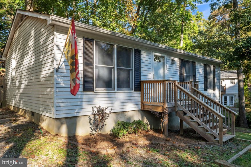 Charming rambler ready to simply move-in.  This home offers two bedrooms with the ability to easily convert back to three.  The bright and airy interior flows from a large living room into the kitchen and dining area with direct access to the back deck. The sprawling fenced backyard just had fresh seed and straw applied for a plush lawn to grow. Convenient location to PAX NAS, shops, and restaurants.