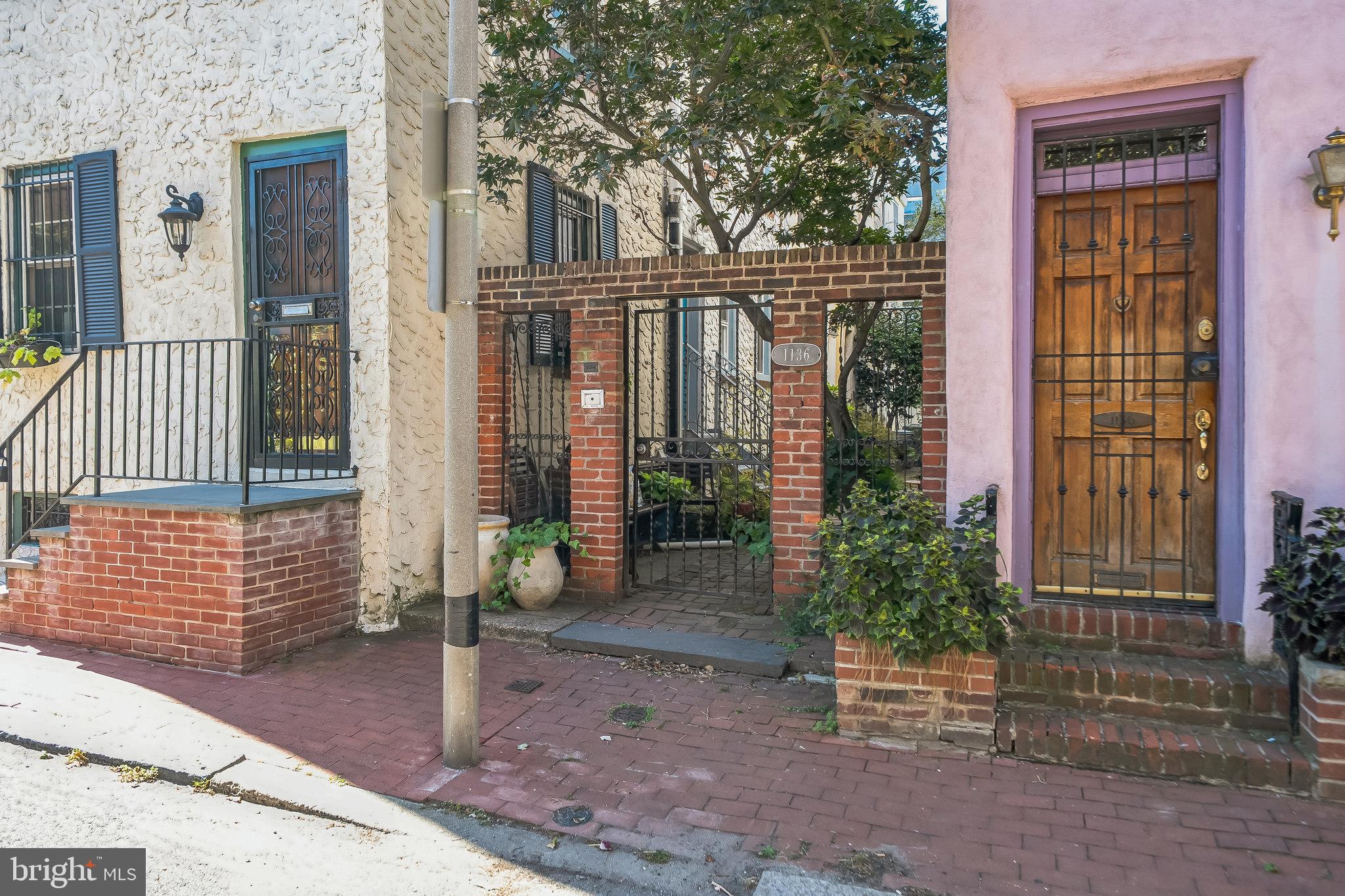 Tucked away in a private, gated brick courtyard on a peaceful, tree-lined street, this beautifully updated trinity sits in the heart of Washington Square West—one of Philadelphia’s most sought-after neighborhoods.
A true piece of the city’s architectural heritage, this home blends the charm of its historic trinity design with thoughtful, modern upgrades. Original details—hardwood floors, a brick fireplace, and beamed ceilings—create a warm, timeless character, while recent renovations add a fresh, contemporary feel.
The inviting eat-in kitchen is a chef’s delight, featuring high-end appliances including a Miele dishwasher, Bosch refrigerator, Grohe sink with touchless faucet, and Wolf oven with induction range. A built-in banquet with hidden storage, topped by a designer Nelson light fixture, makes the space both stylish and functional.
The handcrafted trinity staircase, accented with sculptural custom handrails, leads to the second floor where you’ll find the primary bedroom and a spa-inspired bathroom, perfectly balancing old-world charm with modern luxury. The third floor offers a versatile vaulted space—ideal as a second bedroom, den, or home office—highlighted by exposed beams, recessed lighting, and a cozy gas fireplace.
The lower level provides a full basement with laundry and ample storage, enhanced by polished concrete floors and an exposed brick-and-stone wall that adds character. Outside, the private brick patio and landscaped garden offer a serene retreat, perfect for relaxing or hosting summer gatherings.
Additional features include newer windows, a Nest thermostat, Smith + Noble solar window shades, and a coveted location within the McCall School catchment. Just steps to Midtown Village, Seger Dog Park, Avenue of the Arts, Jefferson & Pennsylvania Hospitals, PATCO, Whole Foods, Acme, and all that Center City has to offer—this “Walker’s Paradise” boasts a Walk Score of 96.
Featured in The Philadelphia Inquirer and Philadelphia Magazine, this home is a rare opportunity to own a stylishly updated piece of Philadelphia history in one of its most vibrant neighborhoods.