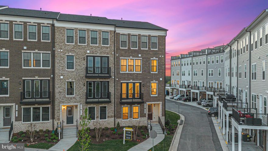 Experience luxury living in this elegant and spacious Gander floorplan by Van Metre Homes, offering almost 2,000 finished square feet on four levels. This end-unit townhome-style condo boasts 3 bedrooms, 2 full and 2 half bathrooms, and a 1-car garage. As you enter, you will be impressed by the versatile first-floor area, perfect for a home office, gym, or a rec room for hosting family and friends' game nights. The area features a mud room area, a half bath, luxury vinyl plank flooring and ample natural light, which radiates through the large windows.

The second level offers an open and inviting atmosphere, perfect for hosting guests. This beautiful new construction home features a stunning kitchen with Ellis Purestyle White cabinets with contemporary metal brushed nickel hardware, Soapstone Metropolis Quartz countertop and matching Calacatta Empire backsplash perfectly complement the cabinets. The kitchen is equipped with a Cairn undermount sink in white and a Simplice faucet in vibrant stainless, adding both functionality and style. The kitchen also features under cabinet lighting and stainless steel appliances, including an Energy Star fingerprint resistant french-door refrigerator, a GE Top Control stainless steel Interior dishwasher, and a gas double oven. A spacious pantry and a half bathroom are conveniently located nearby. The living room area adjacent to the kitchen, with its abundance of natural light that floods in through the expansive windows and the adjacent balcony, creates an inviting atmosphere that exudes a sense of spaciousness and warmth, perfect for relaxation and entertainment alike.

The third level is dedicated entirely to the primary suite, featuring two oversized walk-in closets and a luxurious spa-like bathroom with modern features including two trendy Ellis Purestyle stone-gray vanities with Snow White Quartz countertops and a large glass-enclosed stand-up shower with a built-in seat. A conveniently located washer and dryer are also available on this level. As you ascend to the fourth and final floor, your eyes will be drawn to a generously-sized window above the stairwell that bathes the hallway in natural light, highlighting the soaring ceilings. Here, you will find two expansive secondary bedrooms that offer ample space for relaxation and comfort.

Goose Creek Village, a vibrant Van Metre community, is the home of this impeccable property. The neighborhood offers a walkable lifestyle, with more than 30 retailers, including restaurants, bars, and grocery stores, all situated across the street. Community amenities include a pool, clubhouse, and an outside amphitheater, providing ample entertainment opportunities. The central location of the property, situated midway between VA Route 7 to the north and Dulles Access Road/Dulles Greenway to the south, is a commuter's dream.

Van Metre Homes is a reputable home builder with over 65 years of experience, offering a range of homes, townhomes, and condominiums in the Northern  Virginia area. They stand out from other builders with their commitment to quality, energy efficiency, and customer satisfaction, as evidenced by their numerous awards and recognition from industry experts. Additionally, Van Metre Homes constructs their own building materials, allowing them to maintain strict quality control. Van Metre’s dedication to innovation, sustainability, and customer service has made them a top choice for homebuyers in the area!