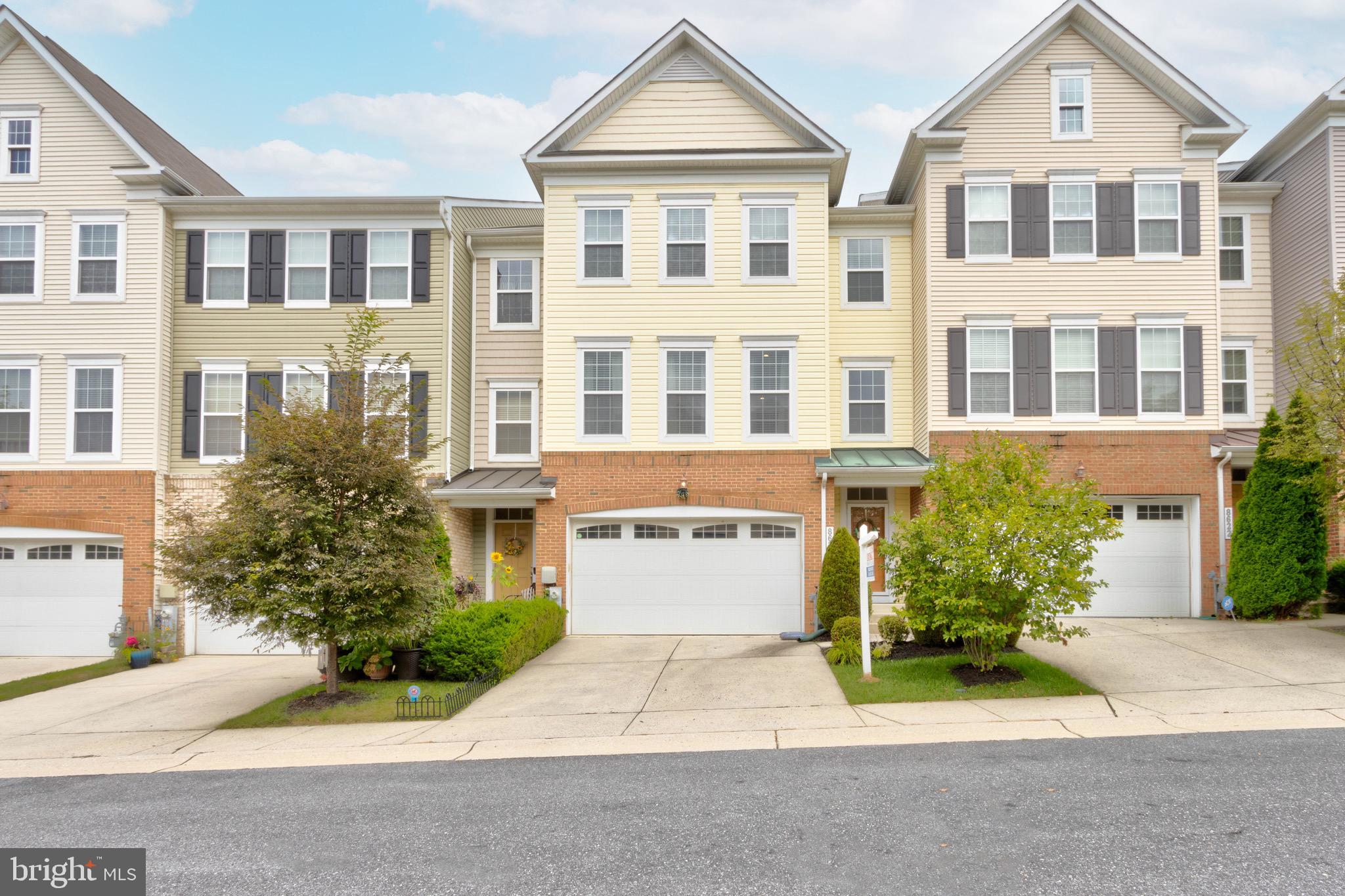 Gorgeous large 4BR town home in sought after Emerson. Open and Spacious, almost 3000 sq ft. Enter on the ground floor with 2 car garage offering a bedroom and full bath, family room with gas fireplace and walk out sliding doors to rear yard. Main level has  hardwood flooring and beautiful crown molding, large living room with recessed lighting, dining area, and large gourmet kitchen with upgrade stainless steel appliances including Samsung 4 door refrigerator, built-in microwave and outside range hood venting, granite counter tops, Espresso 42" cabinets, island with pendant lighting and breakfast bar, large walk-in pantry, walk out to composite deck. Primary bedroom offers elegant trey ceiling with accent lighting, large walk in closet, and large super bath with upgraded tile,  soaking tub, separate shower and dual vanity. Lighted ceiling fans in all top floor bedrooms . Walk-in laundry room, 2 zoned HVAC, natural gas heat, water and range cooking. Great community and location. Emerson located just a short distance to 32 for quick commutes to Ft Meade, Baltimore and DC. Fine dining and shopping available in nearby Maple Lawn, Arundel Mills, and downtown Columbia