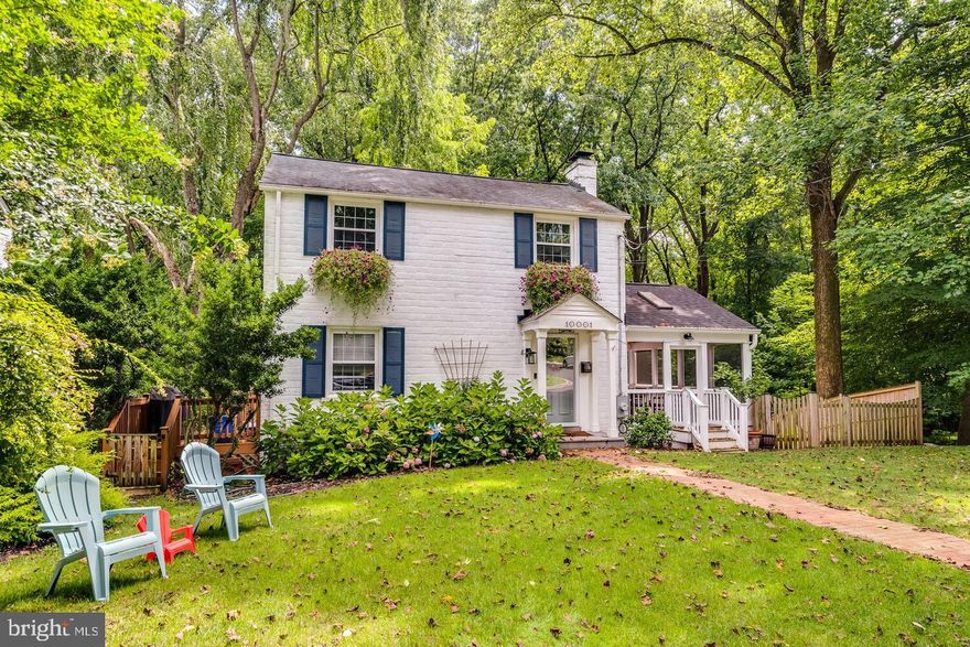 Nestled in the highly sought-after Woodmoor neighborhood, this beautifully updated home offers the perfect blend of charm, functionality, and serene natural surroundings. Backing directly to protected parkland, the setting is both private and picturesque—creating a peaceful retreat just minutes from the heart of Silver Spring.

Inside, over 2100 square feet across three thoughtfully designed levels unfolds with warmth and intention. The main level is anchored by a stunning open-concept kitchen, living, and dining space, where natural light pours in and sightlines flow effortlessly. The updated eat-in kitchen connects seamlessly to the living area and extends out to both the deck and breathtaking screened-in porch—ideal for indoor-outdoor living and entertaining.

A true highlight of the home is the main-level primary suite, offering a rare and luxurious retreat. This inviting space features beautiful views of the lush backyard, custom built-in storage, a walk-in closet, and a tastefully updated ensuite bath—combining comfort and convenience in a way that’s hard to find.

Upstairs, you’ll find two generously sized bedrooms and an updated full bathroom, providing flexible space for family, guests, or a home office. Hardwood floors run throughout most of the home, adding timeless character and continuity.

The walkout lower level offers a bright and spacious family room with direct access to the backyard and stone patio, creating the perfect setting for relaxing or gathering. This level also includes a third full bathroom, laundry area, and extensive storage, ensuring both practicality and comfort.

Outdoors, the fully fenced backyard is a true sanctuary—offering plenty of space to play, garden, or entertain, all while enjoying tranquil views of the surrounding parkland. Whether hosting on the patio or unwinding on the screened porch, this home embraces its natural setting at every turn.

With three bedrooms, three full bathrooms, abundant storage, and meticulous updates throughout, this is a home where pride of ownership shines in every detail—all within one of Silver Spring’s most beloved neighborhoods.