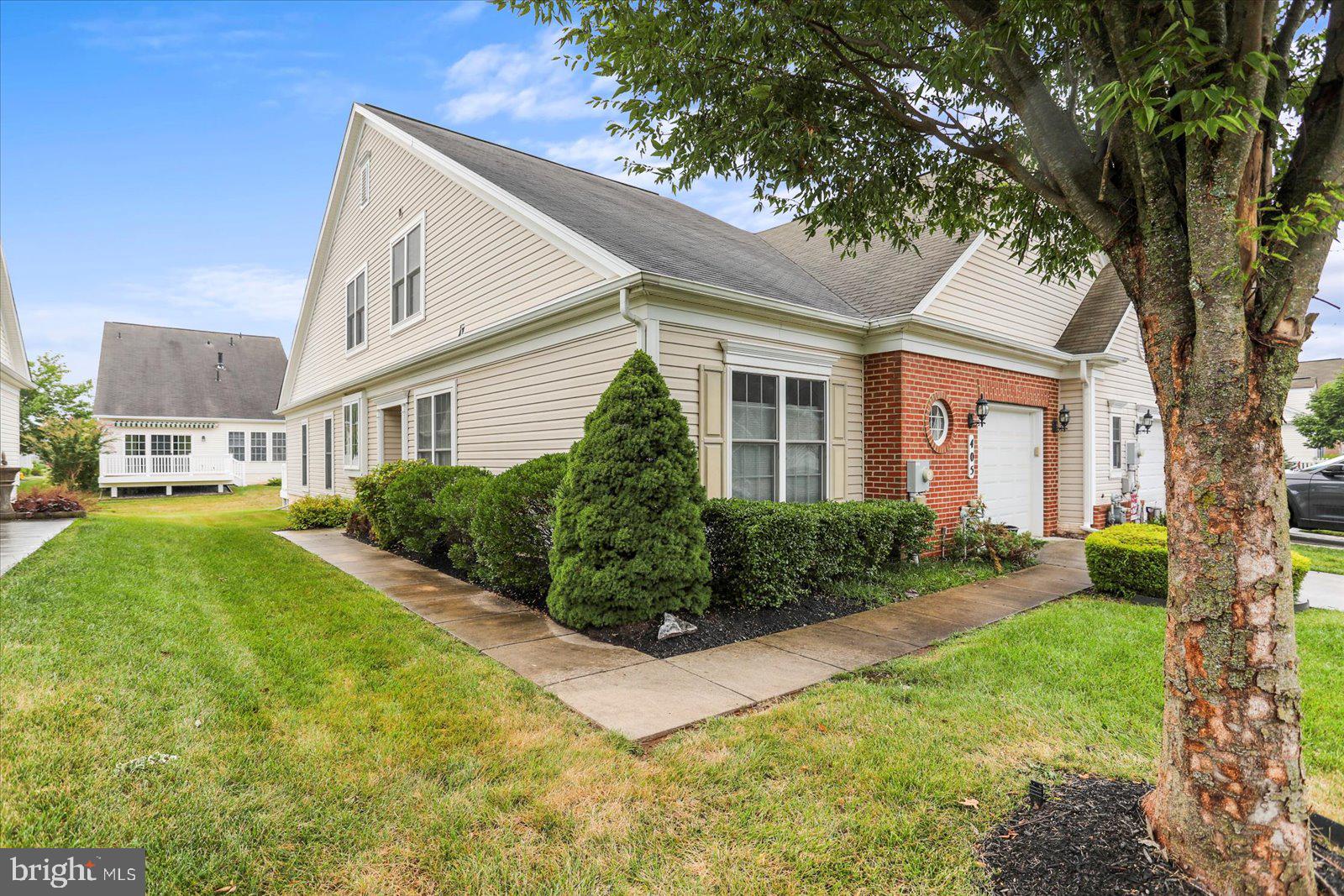 Welcome to this very special home in the sought-after community of Carroll Vista.
Brand-new LVP flooring greets you the moment you step through the front door. Just off the entry, a versatile office/library with elegant glass-paneled French doors provides both natural light and privacy. The primary suite features three oversized windows, a luxurious bath with dual vanities, a step-in shower, and a surprisingly spacious walk-in closet. The second bedroom is bright and welcoming, with two large windows that pour in natural light. Upstairs, an oversized loft offers additional living space, along with a generously sized third bedroom, a full bath, and even extra storage. The living room impresses with its soaring ceiling, striking gas fireplace, and detailed crown molding above the mantle. The upgraded eat-in kitchen boasts granite countertops, 42-inch cabinetry, stainless steel appliances, and abundant counter space—perfect for both everyday cooking and entertaining. Step outside through sliding doors to a maintenance-free deck, ideal for outdoor gatherings or quiet relaxation. Don’t miss your chance to experience the 5-star rated active adult lifestyle at Carroll Vista—where every day feels like a vacation!