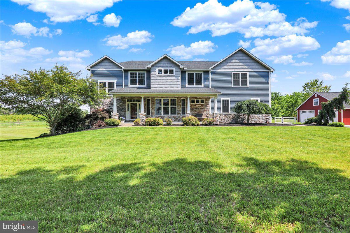 Welcome to 1650 Wolford Rd, a thoughtfully designed custom home situated on over 5 scenic acres. From the moment you arrive, the setting offers a sense of peace and privacy - with a large, stocked pond and a covered rear patio that overlooks it beautifully.
Inside, the home offers 5 bedrooms, 5 full bathrooms and a half bathroom, including two main suites on the second floor. The primary suite features a spa-inspired bathroom with heated flooring, a soaking tub, a walk-in shower, and two walk-in closets. The second suite includes its own walk-in closet with direct access to the upstairs laundry room for added convenience. Every bedroom has access to a full bath, making this home ideal for families or guests.
The main level includes an office, a walk-in pantry off the kitchen, and a cozy pellet stove fireplace. French doors lead from the main living space to the rear patio, seamlessly blending indoor comfort with outdoor relaxation.
Downstairs, the finished walkout basement is filled with natural light and includes a full bathroom and wet bar—perfect for entertaining, guests, or extended living space.
In addition to the attached 3-car garage, there’s also a detached 2-car garage, offering plenty of storage or workshop potential. Dual-zone HVAC systems provide efficient comfort throughout the home, and an instant water heater serves the primary bathroom.
With quality finishes, a smart layout, and an unbeatable outdoor setting, this home is a rare find. Schedule your private tour today.