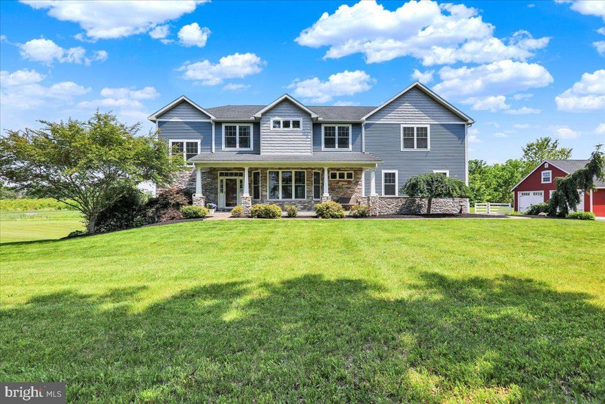 Welcome to 1650 Wolford Rd, a thoughtfully designed custom home situated on over 5 scenic acres. From the moment you arrive, the setting offers a sense of peace and privacy - with a large, stocked pond  and a covered rear patio that overlooks it beautifully.

Inside, the home offers 5 bedrooms, 5 full bathrooms and a half bathroom, including two main suites on the second floor. The primary suite features a spa-inspired bathroom with heated flooring, a soaking tub, a walk-in shower, and two walk-in closets. The second suite includes its own walk-in closet with direct access to the upstairs laundry room for added convenience. Every bedroom has access to a full bath, making this home ideal for families or guests.

The main level includes an office, a walk-in pantry off the kitchen, and a cozy pellet stove fireplace. French doors lead from the main living space to the rear patio, seamlessly blending indoor comfort with outdoor relaxation.

Downstairs, the finished walkout basement is filled with natural light and includes a full bathroom and wet bar—perfect for entertaining, guests, or extended living space.

In addition to the attached 3-car garage, there’s also a detached 2-car garage, offering plenty of storage or workshop potential. Dual-zone HVAC systems provide efficient comfort throughout the home, and an instant water heater serves the primary bathroom.

With quality finishes, a smart layout, and an unbeatable outdoor setting, this home is a rare find. Schedule your private tour today.