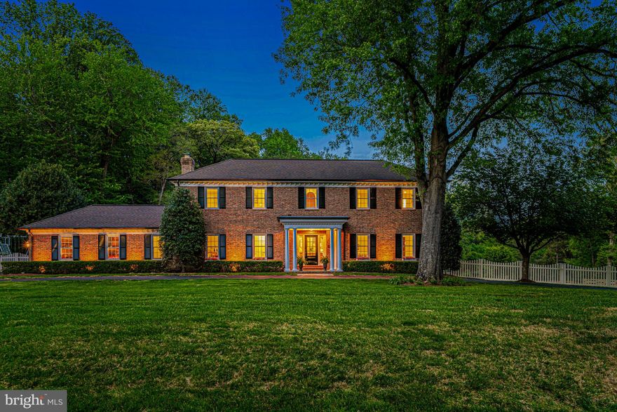 This is a TEN!  Absolutely flawless in a timeless aesthetic, and it has everything you need....including a highly-efficient geothermal system and heated salt-water pool!  Approach this fabulous 5 bedroom 4 1/2 bathroom residence on a circular driveway and enter through the new front door into the spacious foyer.  There are hardwood floors on both levels.  The main level begins with the living room complemented by a formal fireplace, and leads into the dining room with views of the lovely back yard.  The elegant kitchen offers the finest materials, millwork, and appliances, and opens to both the family room (with additional fireplace and built-ins) and sunroom.  The stunning, light-filled sunroom addition is open to the gorgeous kitchen, and overlooks the swimming pool and expansive, fully fenced back yard.  This room features twelve large windows, French doors to the covered patio/pool, and kitchen table space.  The library includes a wall of built-ins.  Between the garage and family room you will find a marvelous combination mud room and dog room with storage, large utility sink, heated floor, and door to the outdoor fenced dog run.  On the upper level are four spacious bedrooms and three bathrooms.   The primary suite presents a stunning marble bathroom with a soaking tub as well as a frameless shower, separate water closet, heated designer tile floor, and more.  The hall and ensuite bathrooms are both beautifully updated with quality materials.  The laundry room and walk-in linen closet complete this level.  Descend to the lower level where you will find a terrific rec room with fireplace and French doors to the back yard.  The fifth bedroom or au pair suite (with separate entrance) and full bathroom are on this level.  Out back is the free-form  heated salt-water swimming pool with waterfall spa and sun shelf that was recently refinished in commercial-grade quartz plaster.  The pool house includes a full bathroom, giving a total of 5 ½ bathrooms on the property.  Beautifully renovated and lovingly maintained, with copper gutters accenting the classic proportions of the residence, this extraordinary property meets all demands and desires.  Welcome to this lovely country retreat in a wonderful neighborhood that provides all the needs and amenities for today's lifestyle.