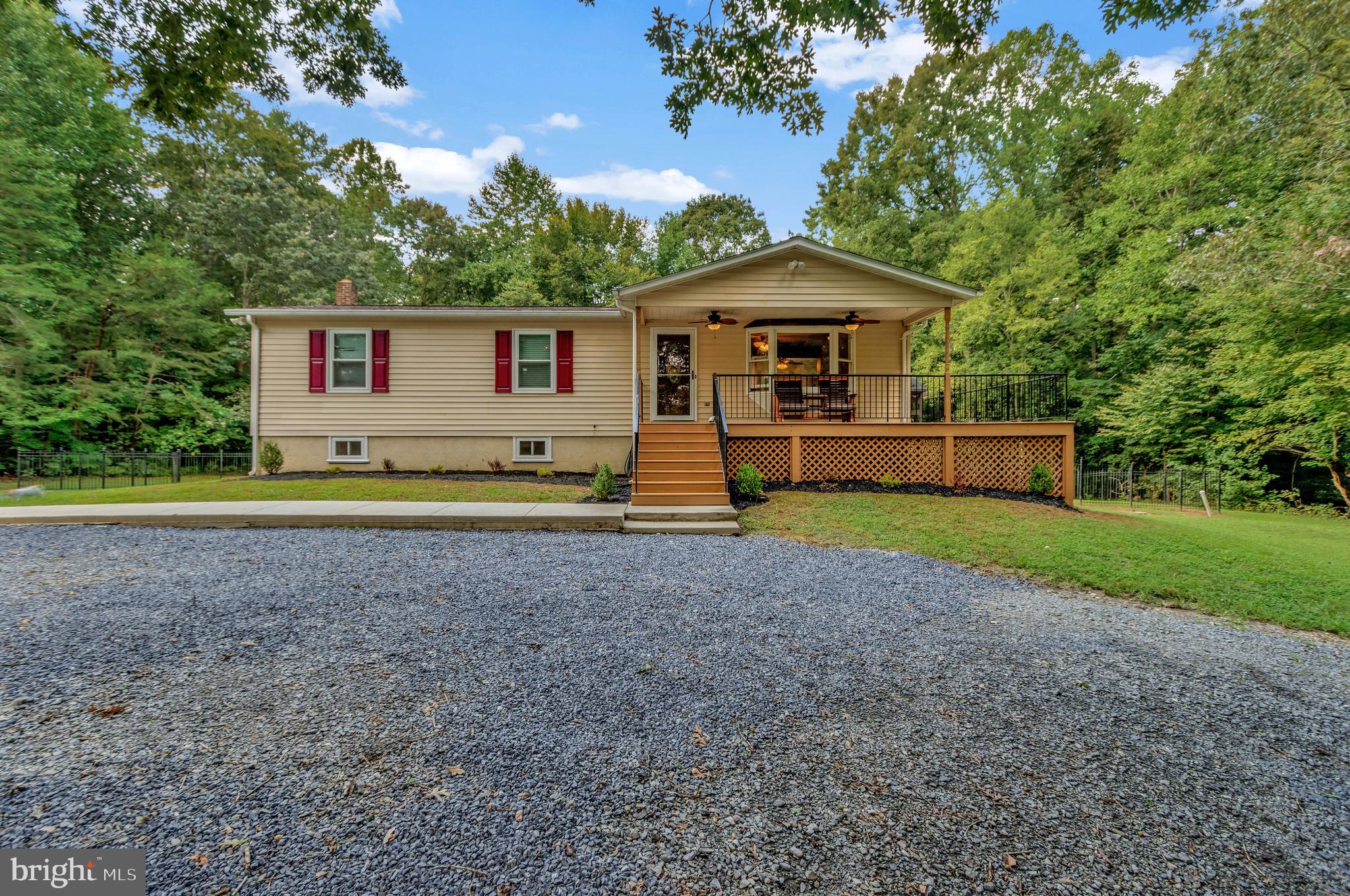 THIS IS THE ONE! BEAUTIFULLY UPDATED 3 BED, 3 BATH HOME ON 5+ ACRES! Spacious and unique open concept living space greets and leads to immaculately renovated custom kitchen...soft close cupboards, upper cabinets, and pantry shelves...Whirlpool fridge, microwave, and dishwasher with stainless internal tub...fingerprint resistant stainless steel stove with air frying and convection capabilities...custom island providing additional prep space and eat in seating...fresh paint throughout...flooring in entry, kitchen, and dining replaced in October of 2020...exposed wood beam adds an additional charming touch...3 sizely bedrooms each with fair share of closet space...Loe Health Smart windows installed in 2020 keep heating/cooling bills at a minimum...laundry room affixed with Amana washer and dryer...cozy fully finished walk out basement provides additional living space and third full bathroom...50 year roof installed in 2017 with a 20 year warranty...recently installed sediment water filtration system...concrete apron and sidewalk...commodious deck offering quiet and grand views of the land...pre cleared section for padsite for future garage/outbuilding. Close proximity to Hughesville, Brandywine, and Pax River! Don't miss out, this serene rural retreat will be gone in the blink of an eye!