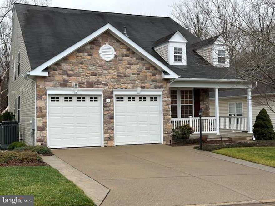 Welcome to your beautiful 55+ Senior Haven!  Nestled in the serene 55+ community of Four Seasons.  This spacious stone front home spans over three levels, 5,000+ sqft, boasting 5 bedrooms and 4 full baths plus an independent living suite in the lower level which includes a full finished kitchen, bedroom and full bathroom with handicapped shower, dining/living room, bonus room  plus a screen enclosed porch with patio backing to trees.    This home is located at the end of a cul-de-sac and backs to trees.   Hardwood flooring on the main level in primary bedroom, living/dining rooms and foyer on main level; two sided fireplace in living/family room.  Living room with crown molding, formal dining room with crown  molding and chair railing.  Laundry room on main level with washer and dryer plus sink and cabinets.  Hall bathroom on main level with walk in shower.  Large kitchen with  silestone countertops, 42” cabinets, black appliances, gas stove, beautiful glass tile backsplash, nice size pantry,  plus space for table and chairs to enjoy your morning coffee.   Off the kitchen is a cozy family room with stone fireplace for those chilly nights.  Off the family room is a beautiful glass enclosed porch and trek deck overlooking woods.  Primary bedroom suite has 2 separate closets, the master bath is a retreat in itself, featuring a soaking tub, walk in shower and 2 separate vanities.  Spacious  loft with bedroom, full bath,  and large TV/game room that looks down onto main level.  Upgraded professional landscaping and walkway along side of house to back,  new outside light fixtures  on front of house, underground sprinkler system.  Sun control window film on rear and right side of house.  Two car garage with shelving and polyaspardic epoxy floor coating.  Awesome club house with indoor and outdoor pools, tennis courts, fitness center, various exercise classes, nature trails, numerous clubs to join, social events.  Minutes to I95, Quantico, historic Occoquan, close to shopping and restaurants.  Come live the good life in Four Seasons!