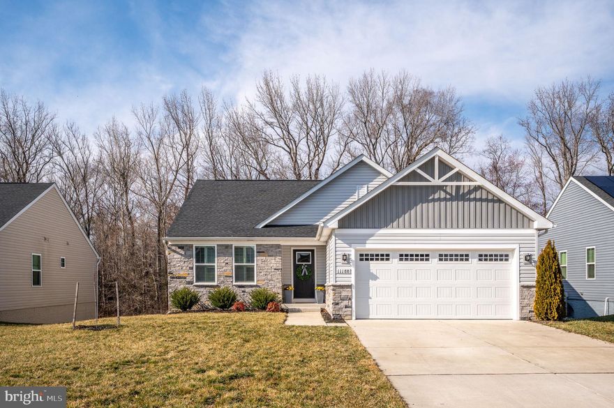 Welcome to easy main-level living in a highly desirable community filled with amenities! This well-maintained home offers 3 spacious bedrooms and 2 full bathrooms, thoughtfully designed for comfort and convenience all on one level.

The bright and inviting layout provides plenty of room to relax or entertain, while the unfinished walkout basement offers exceptional potential—perfect for storage now and ready to be transformed into additional living space, a recreation room, home gym, or guest suite in the future.

Step outside to the covered porch, where you can unwind and take in the peaceful wooded views and quiet surroundings—an ideal setting for morning coffee or evening relaxation.

With its combination of convenient one-level living, expansion potential, and tranquil natural setting, this home offers the perfect blend of comfort and opportunity in a community you’ll love.