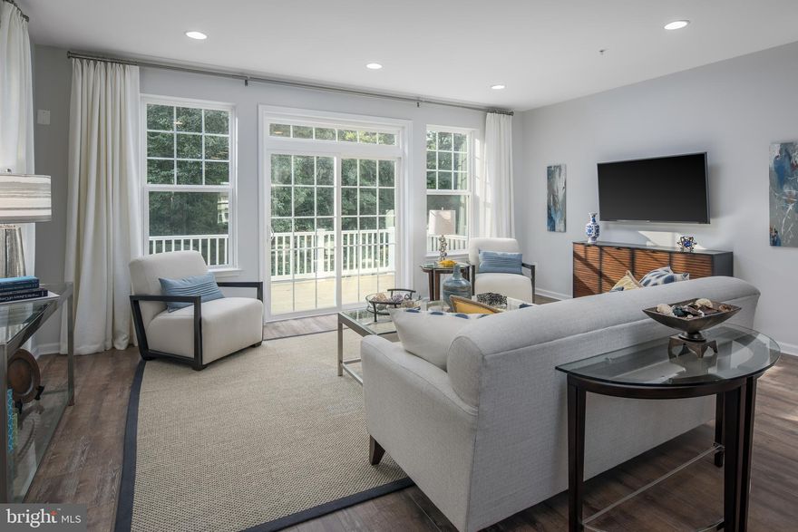 Experience carefree living in this interior townhome in Mill Branch Crossing, a walkable mixed-use neighborhood in Bowie, MD. The Hartland offers a one-car front garage and features 3 bedrooms (two primary suites on the upper level and one bedroom suite on the lower level, and 3.5 baths, The main level showcases a rear kitchen convenient to the deck, including a gourmet kitchen boasting painted Linen cabinetry.  This area is a stylish focal point for the home from the spacious family room.  The finished lower level provides the third bedroom with convenient access to the rear yard.  This home is waiting for you to make it your own and move in this summer. This home is under construction.  Please visit onsite Sales Trailer for information.  Photos are of a similar home.
