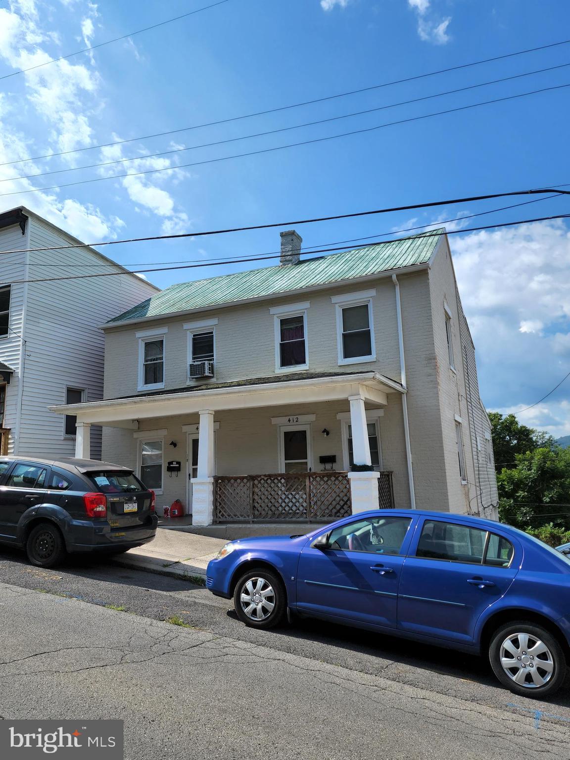 GREAT INVESTMENT OPPORTUNITY! This well maintained Duplex is a MUST SEE! Live in one unit and rent the other to pay your mortgage! Unit #1 (412-Main Level) features 3 beds/ 1 full bath, large kitchen and a spacious living room. Rear porch. Tenant pays $750 per month plus a $50 monthly pet fee totaling $800 per month and all utilities. Updates include: New drywall 2021, fresh paint in 2021, new lighting fixtures in 2021, rewiring of Carbon Monoxide/ Smoke Detectors in 2021, carpet replaced and bath room floor replaced in 2021. New back door and frame replaced in 2022. . Unit #2 (410- Upper Level) features 2 beds/1 full bath. Large living room and an upper level rear deck. Tenant pays $700 per month plus all utilities! Owner pays up to $100 towards water bill. Updates include: Repair/replacement of drywall 2020, fresh paint in 2020, new carpet 2020 and new lighting fixtures! Large rear yard. On/Off street parking! Call today to schedule a showing! Minimum of 24 Hr. Notice is required since both units are tenant occupied. MONTH TO MONTH LEASES. Currently managed by Jose Taylor w/ Western Maryland Property Management Service.