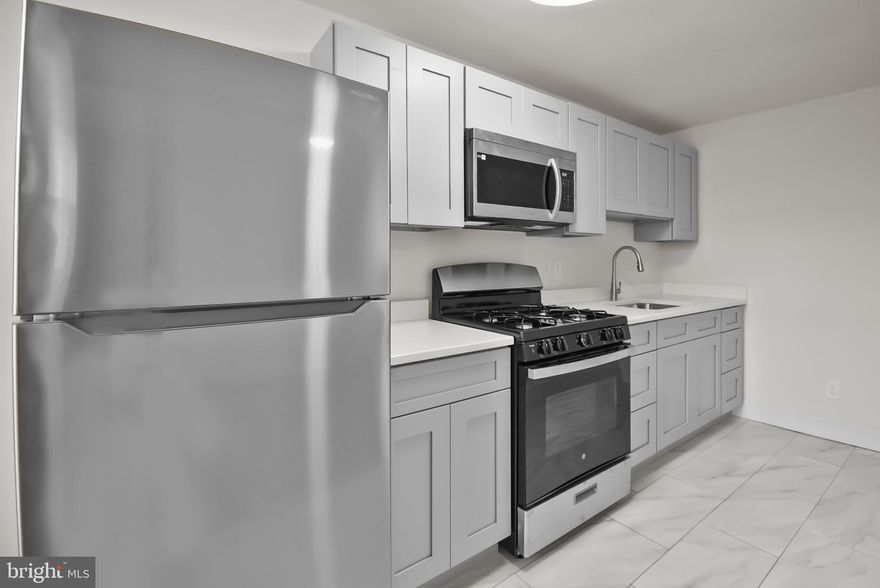 Introducing 1051 Oakwood Dr, an interior unit townhome in Darby Township and Southeast Delco School District. This super clean home offers beautiful hardwood flooring throughout and has been freshly painted. Main floor Living room, dining room and kitchen with stainless steel gas stove, microwave and refrigerator. Upstairs are 3 bedrooms and a remodeled full bathroom. Basement is unfinished with laundry area, plenty of storage space, and a walkout rear exterior door. Parking available on the one-car driveway or in the street. Central a/c and small fenced in front patio and backyard. Tenant pays electric, gas, water, cable/internet if desired and renters insurance. Two (2) pets permitted with owner approval plus monthly pet fee of $25 per month. Available for immediate move-in. $39.99 application fee per applicant over 18 years old for credit/criminal/eviction check. 600 minimum credit score and verifiable income of at least $6,000/month required. Prospective tenants are welcome to apply anytime on Rentspree, contact agent for link.