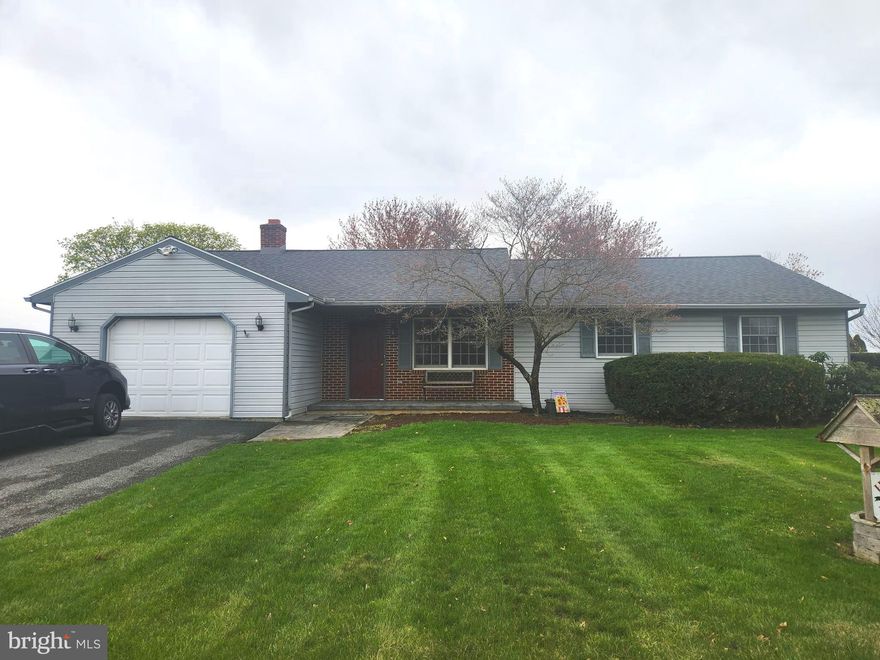 This property will be offered at Public Auction on Tuesday, May 20, 2025 @ 6pm.  The listing price is the opening bid only and in no way reflects the final sale price.  10% down due at auction, 2% transfer tax to be paid by the purchaser, real estate taxes prorated. This ranch home, located in a rural neighborhood surrounded by farmland, is situated on approximately half an acre. The main level includes a living room, a kitchen with adjoining dining area, and a spacious family room with a wood-burning stove and access to the screened porch. Three bedrooms and two full bathrooms are also located on the main floor, including a primary suite with a private bath. The basement features a second family room, an office area, a powder room, and a storage space. Additional amenities include an attached garage, an outdoor deck with access to the screened porch, a 10’x12’ shed, handicap-accessible doorways throughout the main level, and convenient access to Routes 283 and 230.