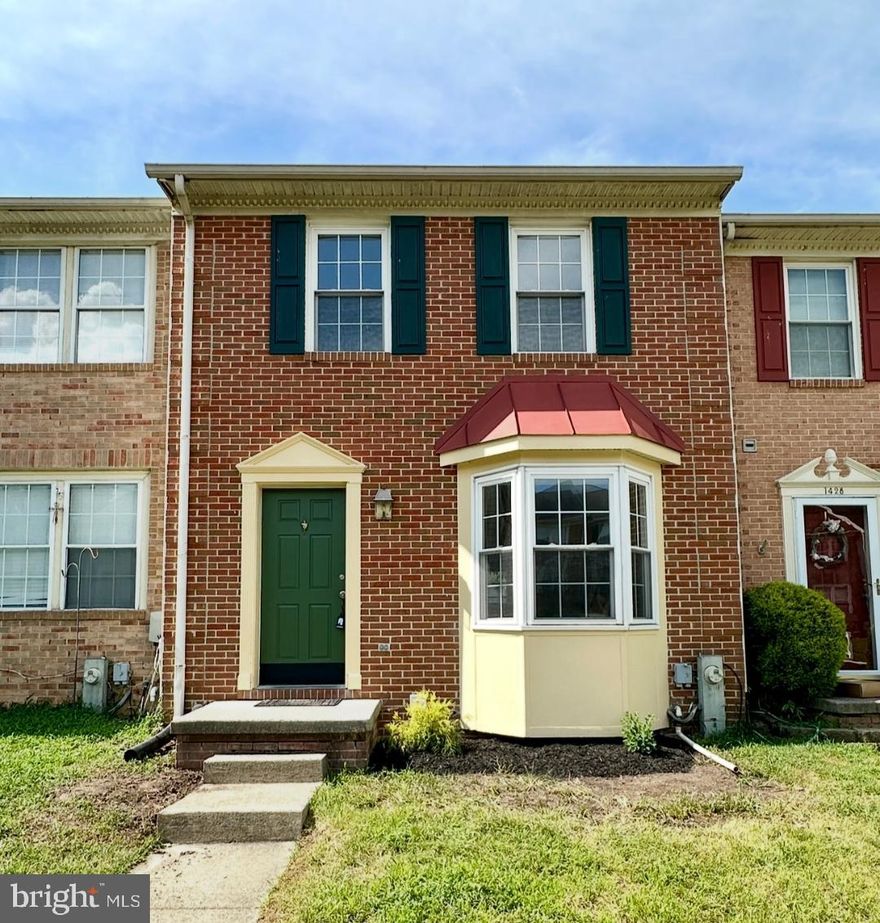 MOVE-IN READY!! Beautiful brick townhome featuring 3 bedroom, 1.5 bath, bay window, deck and spacious kitchen space with white appliances. New paint throughout the house, new wood floorings on main floor and basement, new carpet on upper level. Water heater and HVAC (2018). Assigned 2 parking space. Great starter home. Sold As-Is.