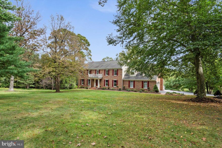 Welcome to this impressive 4,000+ sq ft brick colonial offering 5 spacious bedrooms, 2 full baths, and 2 half baths, perfectly situated on 5 private acres. This home combines timeless elegance with modern upgrades, delivering both comfort and style.
The entire home features gleaming hardwood floors, creating a warm and cohesive flow throughout. The first floor is fully wrapped in custom molding, enhancing the home’s architectural charm. The family room offers a cozy wood-burning fireplace, while the formal dining and living rooms provide the perfect backdrop for gatherings and entertaining.
The gourmet kitchen is designed with both beauty and functionality in mind, showcasing tile flooring, granite countertops, stainless steel appliances, a double oven, and an oversized island ideal for hosting and everyday living.
Upstairs, you’ll find generously sized bedrooms, each outfitted with ceiling fans and recessed lighting in every room for comfort and efficiency. The bathrooms feature custom tile work, including a heated bathroom floor in the primary bath — a true luxury for year-round comfort. Crown molding throughout adds an elevated touch.
Enjoy seamless indoor-outdoor living with a 75x13, 1000 sq ft Tech Deck overlooking the peaceful and private 5-acre setting which gets both morning and evening shade, perfect for relaxing or entertaining. Additional highlights include a whole-house generator for added security and a spacious 2-car garage with ample storage.
Located in the sought-after Blue Ribbon school district, this property offers the perfect blend of privacy, convenience, and refined living — an ideal retreat that still keeps you close to everything.