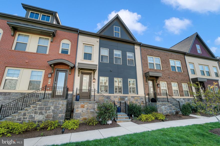 Welcome to Crown Living! This exquisite, nearly-new four-level townhome in the heart of the highly coveted Downtown Crown community is ready to impress. Thoughtfully designed and impeccably maintained elevator unit, this home offers the perfect blend of luxury, comfort, and convenience.

Step inside to discover hardwood floors that flow seamlessly through every level, creating a warm and inviting atmosphere. The main level is an entertainer’s dream, featuring an open-concept layout that connects the living room (complete with a cozy gas fireplace), dining area, and a jaw-dropping gourmet kitchen. Aspiring chefs will be delighted by the kitchen’s stainless steel appliances, marble tile backsplash, soft-close cabinetry, quartz countertops, and an expansive 13.5-foot island—ideal for meal prep, baking, and casual gatherings. The main level also boasts a spacious deck perfect for dining, grilling, or simply enjoying the outdoors, along with a conveniently located half bath.

On the third level, you’ll find two generously sized bedrooms. The primary bedroom has a huge walk in closet and an en suite bath room with double sinks and a double walk in shower. The second bed room has an en suite bathroom as well, ensuring privacy and comfort for family or guests. The walk-in laundry room, complete with a sink and cabinetry, makes tackling chores a breeze.

The top level is a true showstopper, offering unparalleled flexibility. Whether you envision it as a luxurious second owner’s suite or a stunning media room, this space delivers. It features a sitting room, a spa-like bathroom with a glass-enclosed shower, a walk-in closet, and even plumbing ready for a wet bar.

Don’t forget the elevator, providing effortless access to all four floors of this extraordinary home. And the lower level? It’s just as impressive, with a versatile office/sitting area, a second half bath, and direct access to the oversized two-car garage, equipped with a 240-volt outlet for EV charging, plus a two-car parking pad.

Nestled in a quiet corner of the community, you’ll feel a world away while still being just steps from everything Downtown Crown and Rio have to offer: fabulous restaurants, boutique shops, grocery stores, gyms, spas, and more. Plus, you’re minutes from major commuter routes like I-270, the ICC, and the Metro.

As a resident, only a block away, you’ll also enjoy access to "The Retreat," a modern farmhouse-style clubhouse with a pool, tennis courts, and exclusive amenities designed to elevate your lifestyle.

This is more than just a home—it’s a lifestyle. Don’t miss your chance to experience Crown Living at its finest!
