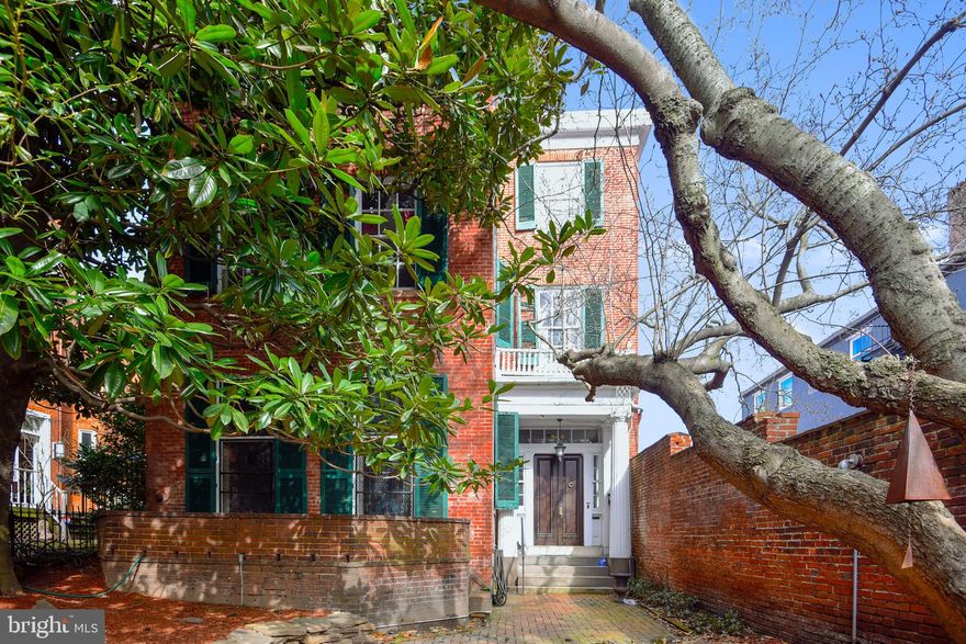 A RARE AND WONDERFUL OPPORTUNITY TO OWN THE GOVERNOR GEORGE HOWARD HOUSE, a Baltimore City Landmark!  As a detached townhouse, the home receives beautiful sunlight from the east, south and north.  With great charm and architectural interest, this handsome house was built in 1845 (+/_) and includes the main house, a three-story carriage house and lovely front and rear gardens. The owner's quarters on all three floors  within the main house, encompass spectacular entrance foyer, front stair hall with eliptical staircase, living room with fireplace, spacious dining room, kitchen, mudroom and generous pantry. Owner's elevator serves floors 1-3.  On 2nd and 3rd floors rear, there's a small one-bedroom apartment.  Carriage house features two garage spaces at street level; upstairs on 2nd and 3rd floor,  a spacious apartment provides solid income.  Renovated approximately 15 years ago, the carriage has spectacular sunlight and very appealing living spaces.  Property does not possess a multi-family license; rental registrations have not been completed.  Small apt.on 2nd & 3ed floor rear is NOT air conditioned.