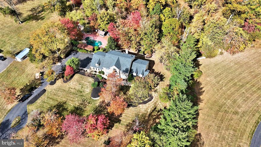 Upper Makefield Township,  Philadelphia  Magazine's "Most desirable place to live in the Delaware Valley"!
( CIRCA  2001)
Gorgeous peaceful and scenic setting on a partially wooded lot with countless upgrades and amenities. Enter the 2 story foyer fitted with wide plank "on spec" hardwood flooring throughout the main level. Flanked by the adjacent formal dining room/butlers pantry and the study. The heart of the home is the family room with a dramatic floor to ceiling stone fireplace, twin French doors and palladium windows opening to the expansive rear decking.  An open floor plan design shares the gourmet kitchen with premium appliances  (Wolf range & microwave, Sub Zero Refrigeration, Bosch Dishwasher)  custom cabinetry, granite counters w/artisan  tiled backsplash, and center island. An extravagant hexagon shaped breakfast room  features a dome ceiling, wall to wall windows and sky lighting. The first floor master suite includes two walk-in closets with custom shelving, a spa-like master bath with soaking tub, roman style shower w/custom glass works, two private commodes with vanities and convenient first floor laundry.  The second floor features three bedrooms w/custom shelving, a shared hall bathroom, hardwood flooring  along with an inspiring media landing that over-looks the main level!
The "Walk-Out grade" lower level transforms this part of the home into an additional living area featuring new flooring, second family room, billiards /game room, potential 5th bedroom, full bathroom, exercise room and indoor hot tub!  Exterior: Professionally manicured grounds, expansive decking along with a picturesque swimming pool and lounge area were designed to flow with the natural topography of the setting. A complete list of upgrades are available along with the seller's disclosure.
----