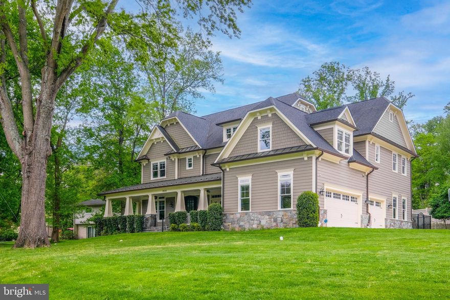 Prominently sited on a fantastic corner lot in the Old Georgetown Estates community of highly-sought after Luxmanor, this magnificent home awaits with six bedrooms, five full bathrooms, one half bath, and a three-car garage.
Enter the front door into a spacious foyer and feel yourself drawn into this home’s enchantment.  
Built on a grand scale yet intimate and warm, exquisite taste radiates throughout this stunning home with Craftsman construction exuding quality and attention to fine architectural detail.
The open and airy floor plan is ideal.  Enjoy parties, intimate gatherings, and silent retreats all within your own home.  

Living and dining spaces of palatial size are enhanced by bright southern exposure, large windows, and abundant recessed lighting, and provide ideal spaces for all manners of gatherings.  To the left of the entrance is a large study well suited for hybrid or work-from-home professionals.  The fully appointed kitchen is perfect for preparing gourmet meals with its granite countertops, built-in appliances, waterfall island, a second deep sink, six burner gas range, walk-in pantry, butler’s pantry, and ample storage for all your culinary endeavors.  The resplendent family room has coffered ceilings and a gas fireplace for your enjoyment.  Accessibility to the front porch from the large formal dining room, and access to the sunroom at the rear of the home encourages you to open up the windows and let the summer evening breeze circulate the entire first floor.  
From the garage there is access to a mudroom with an additional staircase to the upper level.  A substantial bonus room and a large powder room completes the first floor.  

Upstairs five bedrooms provide guest or family accommodations which are served by four beautifully appointed bathrooms.  The primary bedroom has high tray ceilings with recessed lighting and dual walk-in closets adjoined by a private ensuite bathroom with a wrap-around double vanity, jetted tub, and a frameless glass shower stall with dual showerheads.
A lounge area with built-in desks provides additional work and study space.

The sprawling lower level offers a tremendous amount of room for games and recreation.  There is an additional multi-purpose room, a sixth bedroom served by a full bathroom, and a huge storage/utility room.  

The fenced-in backyard is your very own private and personal retreat.  Set in a serene and welcoming neighborhood with mature trees and beautifully maintained properties, super convenient to schools and parks, minutes from all the amenities of Pike & Rose, Cabin John, Westfield Montgomery, Woodmont Country Club and easy access to I-270 and MD-355.
Offering the finest in contemporary conveniences with splendor, comfort, and room to spread out, all that is left to do is unpack.