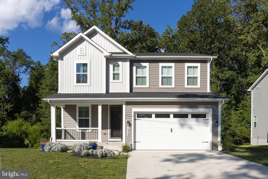 This stunning water-oriented home offers 3 bedrooms and 2.5 bath with a fresh, modern design inside and out. The exterior features two-tone neutral siding, a covered front porch, and clean landscaping that gives the home great curb appeal. Inside, the 9-foot ceilings and an open layout set the tone. The kitchen shines with quartz countertops, white cabinets, stainless steel appliances, a walk-in pantry, and a big island with stylish pendant lights. The great room has a sleek fireplace, and the 12-foot patio sliders flood the space with an abundance of light and open to a massive deck. Luxury vinyl planking flooring runs throughout the first floor for a crisp finish. Upstairs, there’s a spacious loft that makes a great office, playroom, or lounge. All three bedrooms are on the upper level which each have walk-in closets, along with the oversized laundry room-easy living where you need it. The hall bathroom features clean white tile and rough ins for a double sink. The primary suite is a true retreat with a massive walk-in closet and a beautiful bathroom featuring a walk-in shower with matching white tile and modern finishes. The basement is a blank canvas, perfect for an extra bedroom, bathroom, gym, or office. Barely lived in and move-in ready, this home is ideally located near marinas, waterfront restaurants, and just minutes from all major highways—ready for you to embrace the best of this vibrant, water-oriented lifestyle!