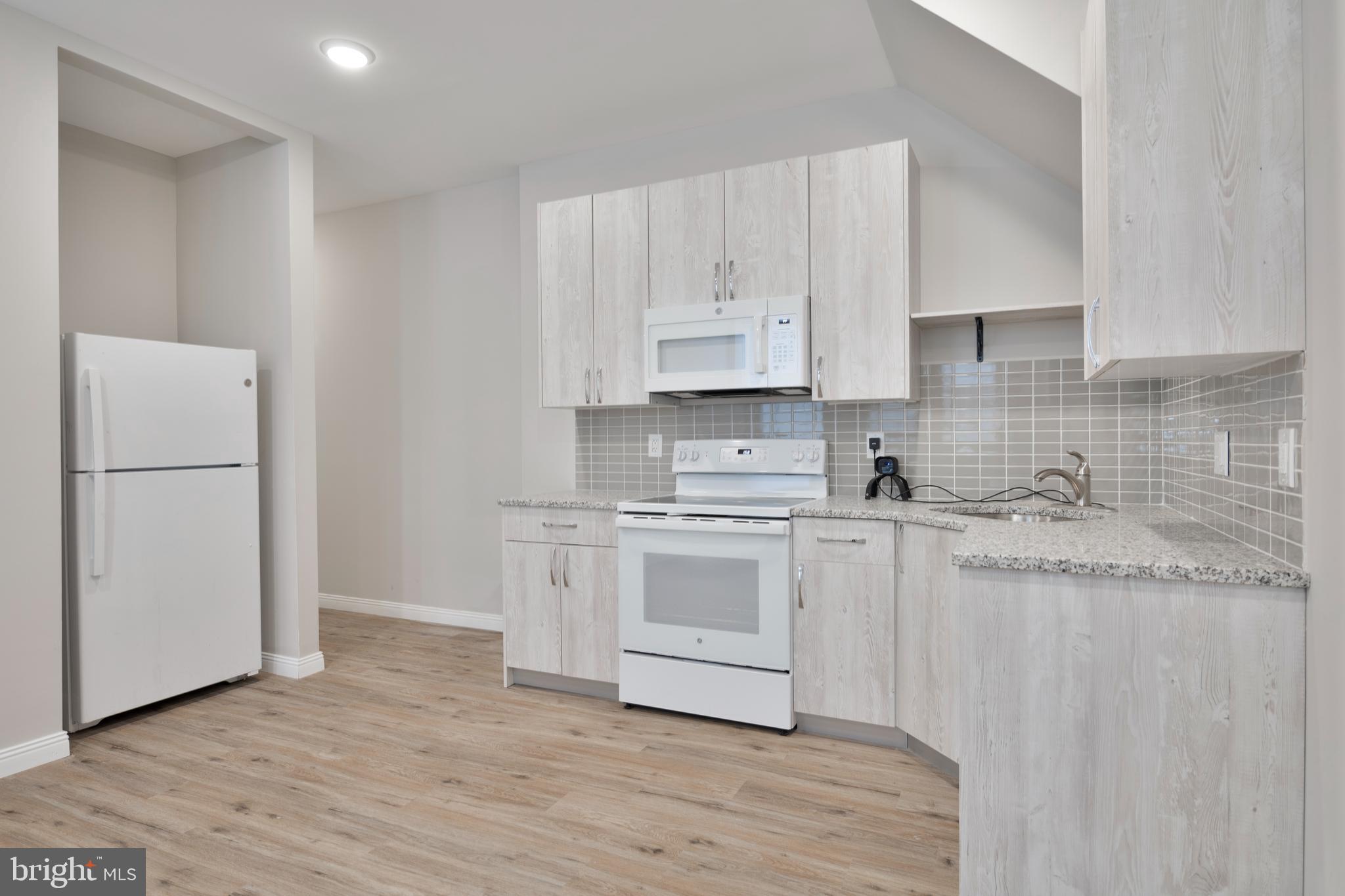 Welcome to 5800 N 17th Street 1F, a newly updated apartment offering spacious living in the vibrant West Oak Lane area. This large two-bedroom, one-bath gem combines style and functionality, making it an ideal place to call home. The modern eat-in kitchen is fully equipped with granite countertops and newer appliances, including a microwave, electric range, and refrigerator. The designer bathroom boasts chic vanities and elegant tiles, creating a luxurious feel. Throughout the apartment, you'll find sleek laminate flooring, adding both durability and charm.
The bedrooms are generously sized and feature large closets, ensuring plenty of storage space for your needs. Convenience is key, as this property is perfectly situated near major routes and offers easy access to SEPTA, making your daily commute a breeze. Whether you're seeking comfort, modern amenities, or a prime location, this apartment ticks all the boxes. Don’t miss the chance to experience West Oak Lane living at its finest!