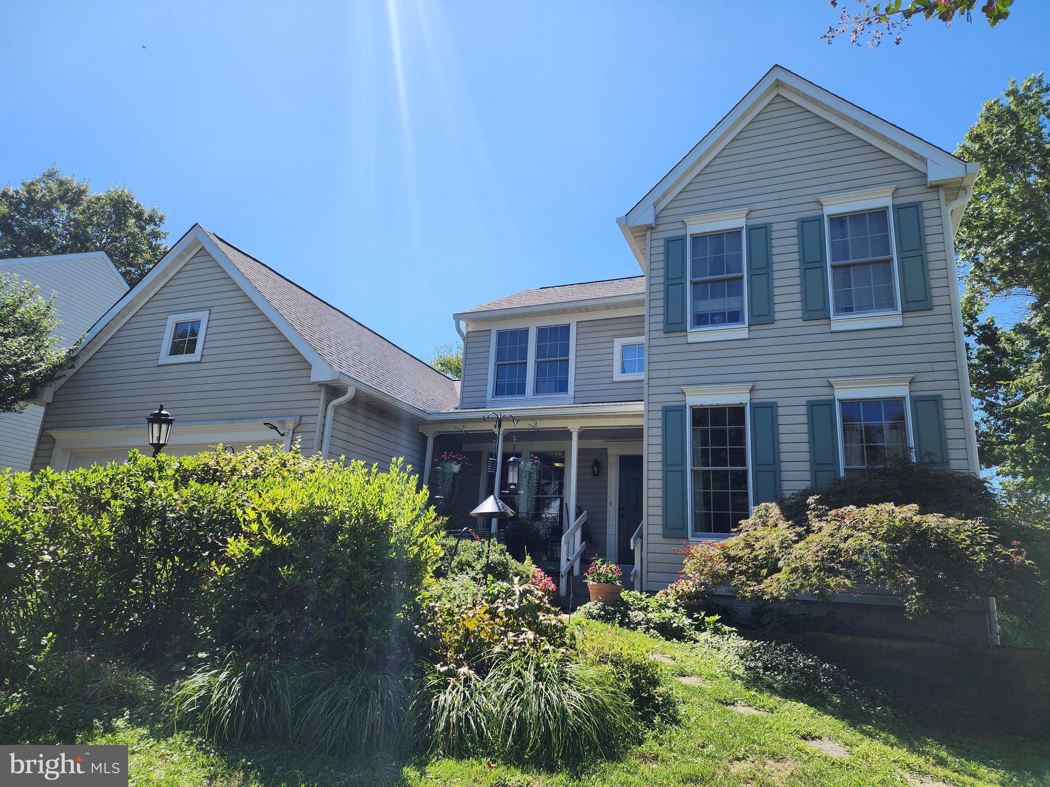 Featuring the opportunity for main-level living, this is a rarely-available home with a primary bedroom suite on the main level that is not in an age-limited neighborhood! You'll appreciate the front gardens, the open floor plan, and the care that the original owners put into this property. Enjoy the living room with its vaulted ceiling and views of the back yard and open space beyond, and the formal dining room. The kitchen with its sunny, full-bay breakfast area overlooking the deck has updates done during the past 8 years, including upgraded appliances and extensive cabinets. A den is located just off the front foyer for a quiet and convenient retreat. The laundry/mudroom (washer and dryer 2021) is just off the kitchen. And the primary suite includes a bright bedroom with walk-in closet, and an updated bathroom with double vanity and walk-in shower. Upstairs, two of the three bedrooms have walk-in closets, and the full bath has a tub/shower combination and a double vanity. The walk-out basement has sliding glass doors to the rear yard, and has been a terrific workshop and hobby space. An accessory gas stove with tile surround is installed for extra basement coziness and conveys as is since rarely used. The house includes owned solar panels, an EV charger (2024) in the double garage, central vacuum, an updated electrical panel (2024), and a hybrid water heater (2024). The roof was replaced with 50-year shingles in 2016. Seller reserves the right to request that buyers get a second opinion from lender of seller's choice.