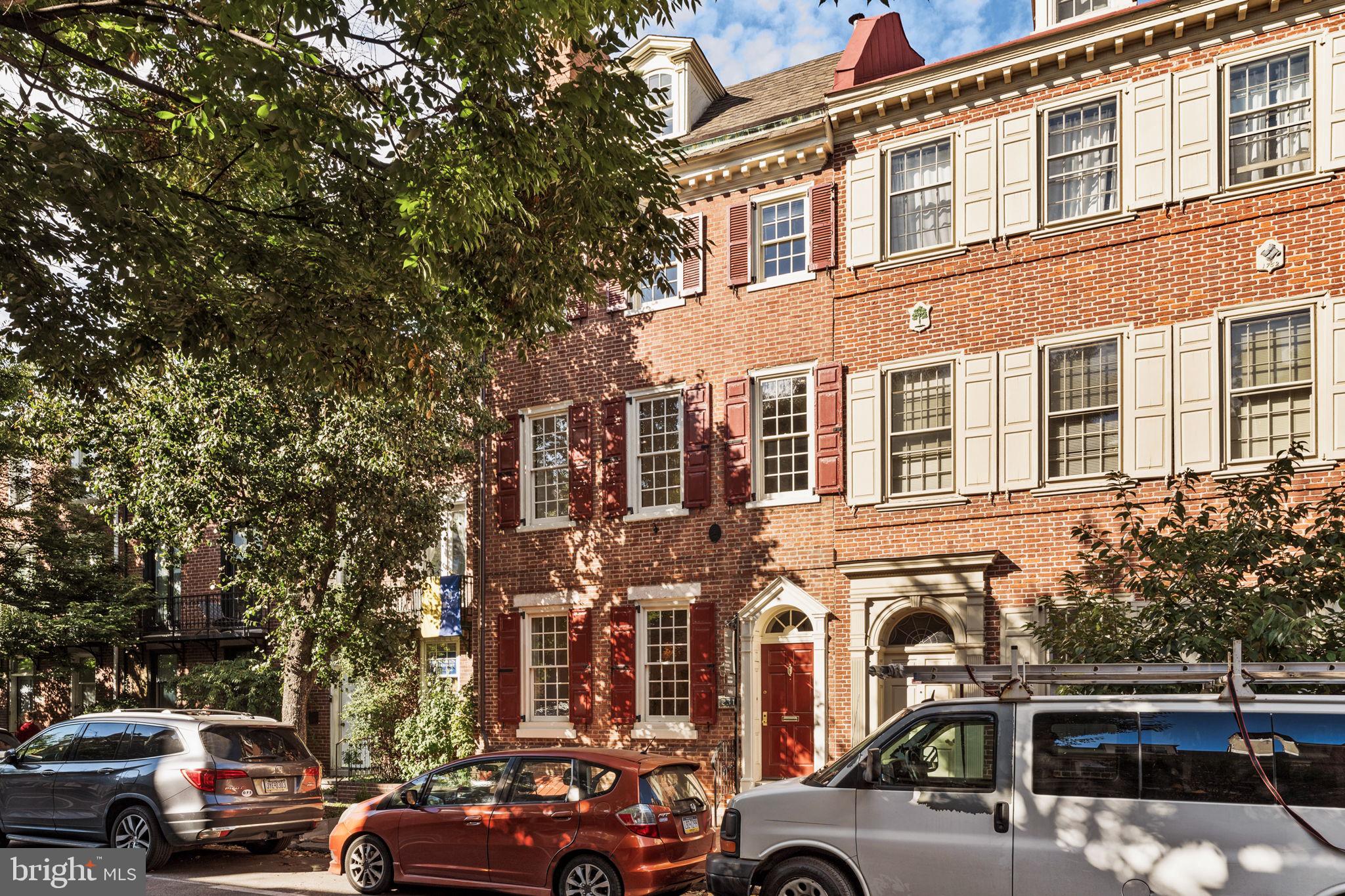 As featured in the book “Restoring a House in the City”; Historic charm meets modern luxury at 231 Spruce Street in Philadelphia’s exclusive Society Hill neighborhood. This beautifully reimagined home, with its 20' width, boasts large-paned windows that flood all four floors with southern light, illuminating its 3,400+ square feet. Featuring 4 bedrooms, 2.5 bathrooms, and a spacious bonus room with a wet bar and custom shelving, this home offers gracious living at its finest.
A harmonious blend of contemporary design and historic elements, the home underwent a thoughtful renovation a few years into the 21st century. The expansive living room retains its original pine floors (throughout) and a King of Prussia marble fireplace with a Mercer tile surround. This space flows seamlessly into an elevated dining room, which boasts a large skylight and double French doors with phantom screens that open to a meticulously maintained side garden.
The bright, spacious eat-in and renovated kitchen, features top of the line appliances, cabinetry, a panoramic paned-glass window overlooking the rear garden, is perfect for culinary enthusiasts and includes a door to the patio for outdoor grilling. Discretely located nearby are doors to a charming powder room and access to a finished basement with a tiled wine cellar, large cedar closet, and ample storage.
The second floor is home to the luxurious primary suite, which includes its own washer and dryer, two cedar-lined walk-in closets, and an elegant ensuite bath adorned with artistically set Italian Bisazza mosaic tiles, dual sinks, a double shower with dual rain shower heads, and a uniquely positioned soaking tub. A secondary bedroom is also located on this floor.
The third floor offers two additional bedrooms and a spa-like hall bathroom, while the top floor features a spacious bonus room with vaulted ceilings and exposed beams, providing a tranquil retreat.
Your 1-year prepaid parking is just down the street.
Lastly, 231 Spruce is centrally located near public transportation, Philadelphia’s historic district, and the finest restaurants and shops in the city making it the perfect blend of historic elegance and modern convenience. Your search ends here!