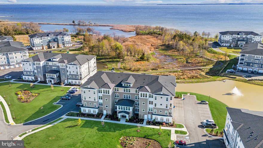 Just reduced by $30,000 to $710,000 with immediate availability. This is one of only two  3-bedroom condos on the market in Four Seasons with the immediate availability. Welcome to luxury condo living at Four Seasons at Kent Island, an active 55+ community packed with amenities. No need to wait for a new condo to be built – you can move in now to 170 Harrier Way #34. This third floor Severn model (3 BR / 2 ½ Bath / 2,602 sqft) offers beautiful views of the Chester River and nearby tidal pool. Inside, sunshine fills the unit with light throughout the day and the numerous windows are treated with Hunter Douglas luxury blinds when you have had enough sun. The home offers an open concept layout. The kitchen includes the upgraded package which includes stainless steel GE Profile appliances (including refrigerator, gas stove, oven, microwave, refrigerator, and dishwasher), a gourmet island with quartz countertop, pendant lighting, staggered cabinets, backsplash, and dry bar. The great room offers water views and added tranquility with an Allusion 60” fireplace. The master bedroom is spacious and includes two sizable walk-in closets and includes a sitting room with water views along with patio access. Both guest rooms are spacious and offer ample closet space. On the first floor, the unit includes a private 1-car garage along with a climate-controlled storage room. The gem of the community is its 24,000 sq. ft. clubhouse that includes indoor & outdoor pools, a state-of-the-art fitness center, a yoga studio, locker rooms, a game room, a library, three large social gathering areas with TVs and kitchens.  Outside of the clubhouse is a resort-style pool with direct views of the Chester River, a beach area with fire pits, a patio with gas fire pits, a bar area, a performance stage, miles of walking and biking trails, tennis courts, pickleball courts, basketball, bocce ball, children’s playground, dog park, kayak/paddleboard launch area with storage racks, boat pier for visitors, and much more. There are numerous clubs, fitness sessions, and events to join and start interacting with your neighbors right away.  A sampling includes cooking club, book club, yoga, pilates, cross-fit, strength training, golf,  pickleball, line dancing, aqua fitness, cards, billiards, and many more. With a full-time lifestyle director on site at the clubhouse, there is no reason to leave home. However, if you do, Four Seasons offers convenient access to Route 50, Annapolis, DC, Baltimore, BWI airport, and the Eastern Shore and beaches. Kent Island itself offers amazing waterfront dining options, shopping, the nearby Queenstown outlets, world class boating, the Blue Heron county golf course, and miles of cross-island biking trail surrounded by views of the Chester River and Chesapeake Bay. What are you waiting for? Start living the luxury island life today!