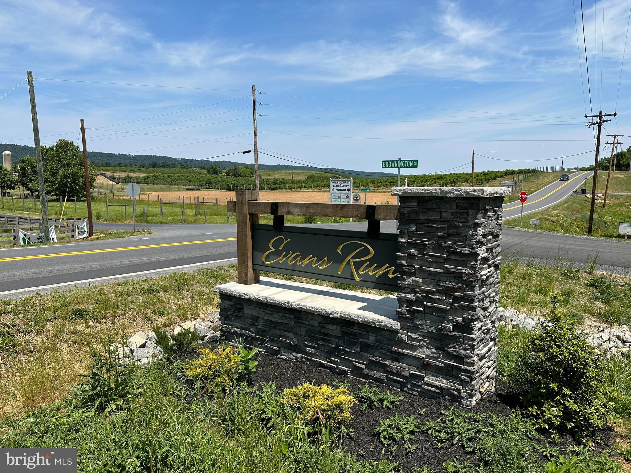Nestled in the foothills of theWest Virginia Mountains lies the peaceful community of Evans Run. Here you'll find the perfect lot to build your forever home!
Evans Run is that touch of the country you need while still being close to all the conveniences of Martinsburg, WV. This gorgeous two acre lot is just a gem, surrounded by beautiful farmland and mountain scenery. Subdivision roads and utilities are already in place. The lot sits at the highest point of the neighborhood with stunning views of North Mountain. More than 2/3 of the property is wooded. The neighborhood has newly paved roads and features custom built homes with a total of just 32 lots - all of which are over 1.4 acres. Don't wait, call today!