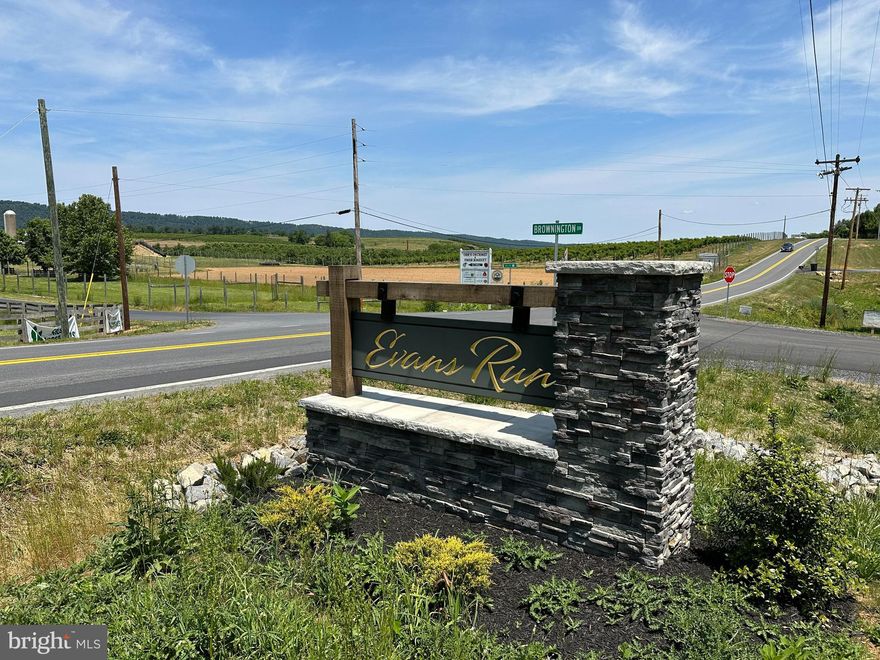 Nestled in the foothills of theWest Virginia Mountains lies the peaceful community of Evans Run. Here you'll find the perfect lot to build your forever home! 
Evans Run is that touch of the country you need while still being close to all the conveniences of Martinsburg, WV. This gorgeous two acre lot is just a gem, surrounded by beautiful farmland and mountain scenery.  Subdivision roads and utilities are already in place. The lot sits at the highest point of the neighborhood with stunning views of North Mountain. More than 2/3 of the property is wooded. The neighborhood has newly paved roads and features custom built homes with a total of just 32 lots - all of which are over 1.4 acres. Don't wait, call today!