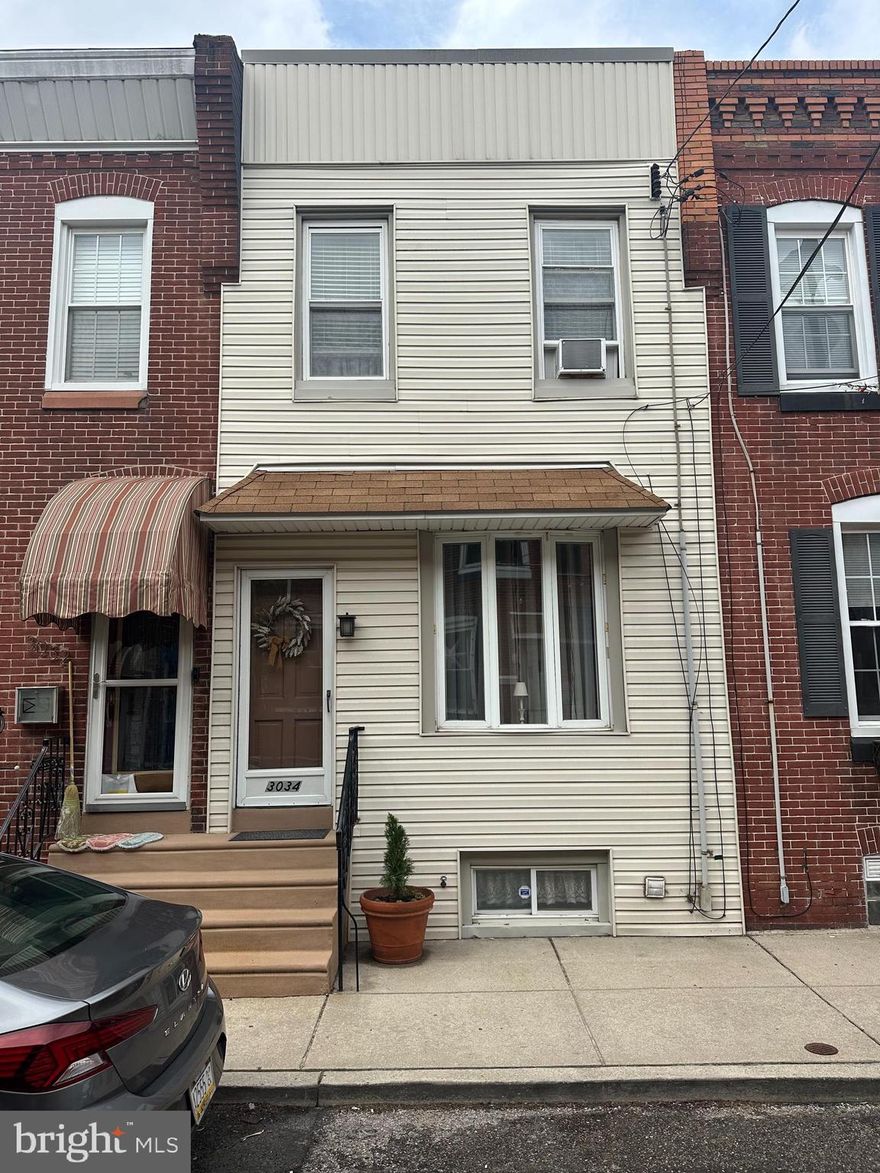 This is a very clean, move-in-ready 3-bedroom, 1-bath home located on a wonderful street in the heart of Port Richmond. A library sits at the end of the block, and a playground is just half a block away, making it an ideal spot for convenience and family living.
The first floor features a vestibule entrance leading into a spacious living room adorned with crown molding, two ceiling fans, freshly painted walls, and newer sheetrock. Ceiling fans are installed in every room throughout the home for added comfort. The dining room and kitchen flow seamlessly together, with the kitchen opening to a generously sized backyard—perfect for the area.
Upstairs, the second floor offers three nicely sized bedrooms and a well-appointed hall bathroom. The full-sized basement is exceptionally clean and boasts significant upgrades, including a new sewer line installed in 2023, fully cemented walls, a newer heater, and a newer water heater. It also provides ample storage space.
The home is equipped with a new rubber roof (installed in 2024), newer windows, and updated siding. With a 100-amp electrical panel and no mechanical issues, this property is in excellent condition and ready for its next owner.