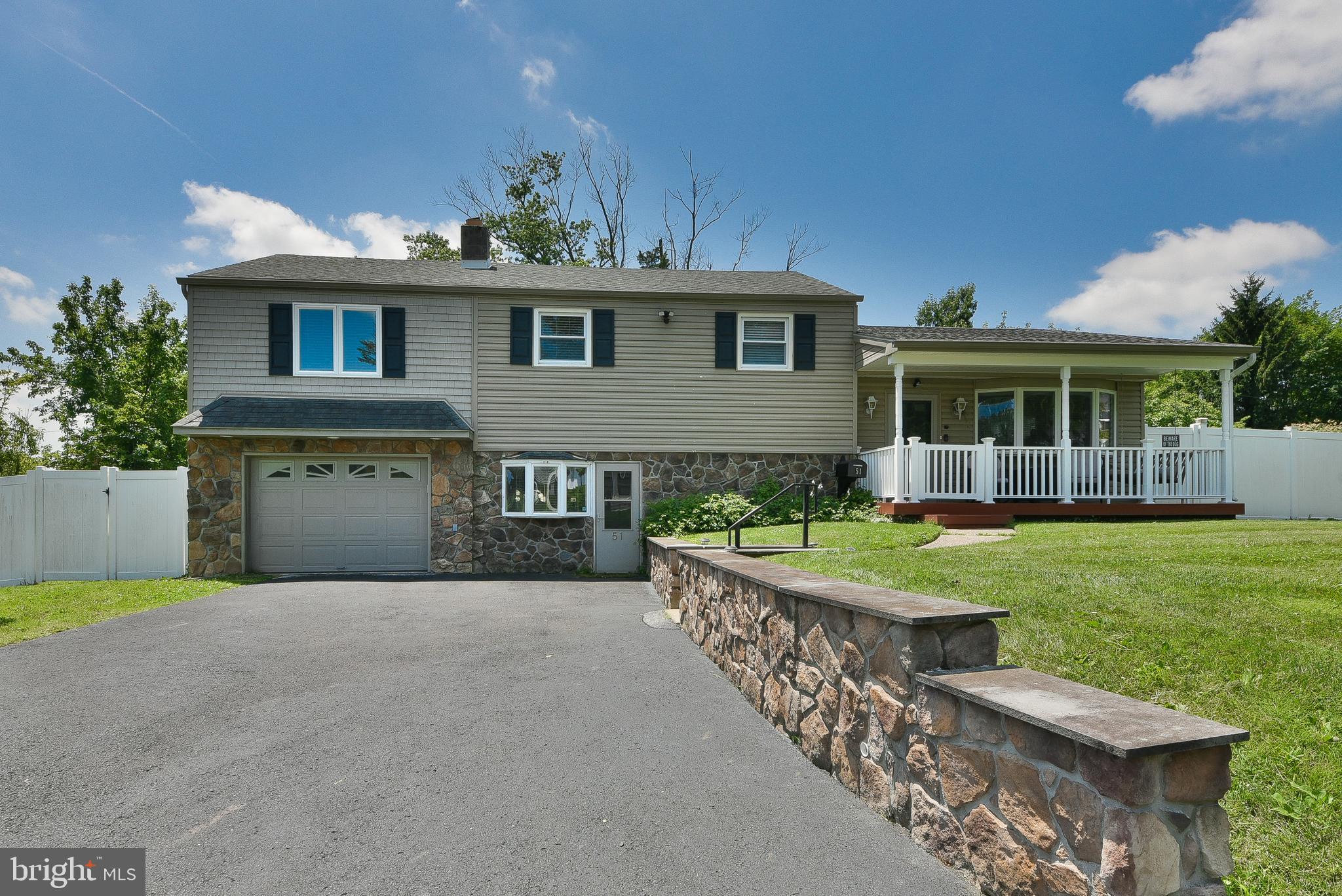 Welcome to 51 Lewis Street, a beautifully updated split-level home located in the heart of Lower Southampton Township within the highly regarded Neshaminy School District. Offering 4 spacious bedrooms and 2.5 bathrooms, this residence combines comfort, functionality, and timeless appeal. Situated on a well-maintained lot in a quiet neighborhood, the exterior features attractive stonework, a covered front porch, and an extended driveway leading to garage with interior access. Inside, the main level boasts a bright, open-concept living and dining area with crown molding and recessed lighting, seamlessly connected to an updated kitchen with granite countertops, tile backsplash, and stainless steel appliances. The lower-level room is perfect for gathering and relaxing, complete with a charming brick fireplace and direct access to the backyard. Upstairs, the primary suite includes a private full bath, with 3 additional bedrooms offering plenty of space for guests. Additional highlights include a finished basement, as well as a dedicated laundry area, ample storage, and energy-efficient windows throughout. The private fenced-in backyard features a covered deck with retractable awning—perfect for outdoor entertaining—as well as a large shed for additional storage. Conveniently located near shopping, dining, parks, and major commuter routes.