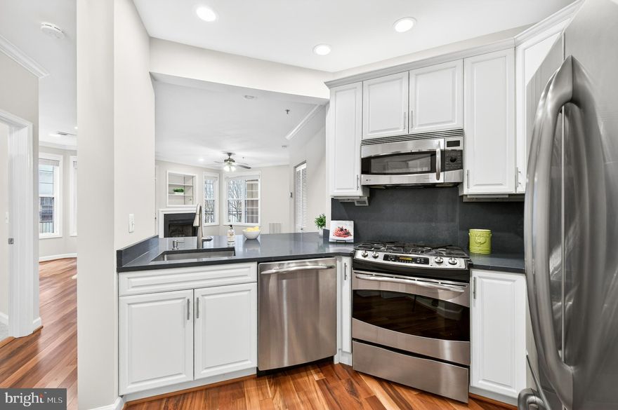 Open House Sat 1/24 10am-12pm.  Don't miss your opportunity to live in this rarely available 2BD 2BA corner unit with an enormous, elevated wrap around balcony in the coveted Courthouse Hill community! Your new home is nestled on a quiet street, yet a block or two away from everything Courthouse and Clarendon have to offer! Upon entering the home, you will find the spacious updated gourmet kitchen to your right, featuring 42" white cabinets, quartz counters, gas cooking and stainless-steel appliances. Enjoy a casual meal at your oversized quartz counter bar with ample seating space. To your left, you will find the updated secondary bath and a generously sized secondary bedroom that's fully equipped with a queen size Murphy Bed and built in bookshelves. The secondary bedroom also has its own closet with custom shelving and new carpeting. Entertaining is easy in the large living /great room with its open floor plan and tons of windows. The sun pours through the windows onto the gleaming hardwood floors, which highlight the cozy gas fireplace that will take the chill off of a cold winter's night.  The great room flows out to the enormous, elevated wrap around balcony, perfect for relaxing after a long day at work or entertaining friends. The primary bedroom suite boasts new carpeting, a walk-in closet with custom shelving and an updated en-suite primary bathroom with a glass shower and built in shelves. Washer and dryer are located in the unit. Secured garage parking provides convenient covered access. The building amenities are also impressive, from the pool to the entertainment terrace, to the fitness center and the club room. It's hard to find gas heating, gas cooking and a gas fireplace in such a close in location! Condo fee includes water, sewer and trash.
Freshly painted and new carpet make this home move in ready. This location can't be beat, conveniently located near the metro, restaurants, cafes, shops, grocery stores, theaters and more and only 1.4 miles to DC! Welcome Home!