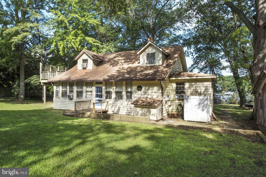 THIS IS DEFINITELY ONE OF A KIND--TUCKED AWAY, PRIVATE 1.9 ACRE WATERFRONT SITE W/CHARMING COTTAGE THAT TAKES YOU BACK TO THE GOOD OLD DAYS--NEWER PIER W/BOAT LIFT AND 2 JET SKI LIFTS--OUTSIDE SHOWER--UPPER LEVEL IN-LAW APARTMENT--OVER 200' OF SHORELINE--GREAT OPPORTUNITY TO BUILD THE HOUSE OF YOUR DREAMS--PLEASE EXPLORE THIS AMAZING PROPERTY--YOU HAVE TO SEE IT TO APPRECIATE IT!!