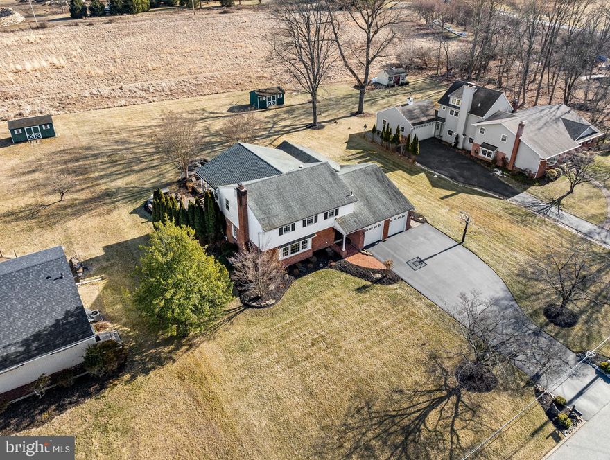 Welcome to 342 Old State Road, a stunning residence nestled on 0.69 acres of professionally landscaped grounds in the highly sought-after Coldstream neighborhood within the Tredyffrin-Easttown School District. Meticulously designed inside and out, this home offers over 4,000 square feet of living space and a luxurious backyard retreat! As you step inside the foyer you will immediately notice the custom millwork, abundant lighting, and radiant heat tile floors, showcasing the attention to detail carried throughout this home. To the left, a versatile living room or office space with French doors, classic wainscoting, and a wood-burning fireplace with mantle offers a cozy, elegant touch. Hardwood floors and decorative millwork continue into the expanded dining room, perfect for hosting large dinner parties. The heart of the home lies in the open-concept kitchen which flows seamlessly into the breakfast room and offers a separate work zone with built-in desk. The well-appointed kitchen features custom Goebel solid wood cabinetry, a large center island, a buffet with glass-front display cabinets, and high-end stainless-steel appliances, including Samsung Refrigerator, Fisher & Paykel gas cooktop, Bosch dishwasher and double wall oven and a wine frig. The family room, with its vaulted ceiling and striking stone fireplace, is the perfect space for gathering. Serve guests at the pub-style bar, featuring dual tap kegerators and a beverage fridge, and enjoy music through the Sonos surround system, with speakers also in the sunroom, primary bedroom, and outside. The double-sided gas fireplace is shared with the sunroom, which boasts a vaulted wood-paneled ceiling, expansive windows, and panoramic views of the lush surroundings. Step outside to your own private oasis, where the backyard is an entertainer’s dream! With dual-zoned landscape lighting, custom hardscaping, and thoughtfully designed spaces, you’ll find everything you need to relax and entertain. Enjoy dining al fresco on the patio, unwind by the stunning waterfall feature or gather around the fire pit. There is a designated grilling area with a built-in gas line and a secluded area plumbed and wired for a hot tub. A spiral staircase leads up from the patio to the balcony off the primary suite, offering serene views of the property. Completing the main level, you'll find a convenient powder room with radiant heat floors and a mudroom/laundry room with built-in storage lockers and access to the two-car garage. Upstairs, the thoughtfully designed primary suite is a true sanctuary, with sliding doors opening to a shaded balcony and a spacious walk-in closet equipped with a custom Closets-By-Design system. The en-suite bath provides a spa-like experience with radiant heat floors, a spacious walk-in shower and a lavish soaking tub. Three additional bedrooms, each with recessed lighting and ceiling fans, share a beautifully updated hall bathroom. A bonus room, currently used as an office, adds flexibility for your needs. The finished basement features a gas fireplace with built-in bookcases, a half bath, and ample space for a den, workout area, or playroom. When you are not hosting at home, walk to nearby shops, restaurants and parks. Enjoy cycling, tennis, pickleball and more at Teegarden Park and the Chester Valley Trail, and take part in the various events hosted by this active neighborhood, like the upcoming Egg Hunt. This property is close to major highways and the Berwyn Train Station making your commute into Philly a breeze. This home has it all! Schedule your showing today!