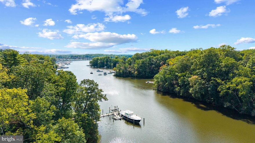 Great opportunity for a waterfront home on the shores of Gingerville Creek, perfectly located down a private driveway, surrounded by trees and sited at the best elevation to take in the views. Embrace the waterfront lifestyle and enjoy the serene views from inside and outside of the home. This contemporary waterfront get away sits on 1.45 acres with 190' of waterfrontage and private pier. The 3 bedroom, 2.5 bath home features hardwood floors, soaring ceilings with beams, wood burning fireplace, generously sized rooms, and convenient main level primary suite with full bath. This charming home is ready to move in as is or provides the perfect chance to customize every detail to your liking. Bring your imagination and your architect! Setback off the road and sited to take advantage of the captivating views, the options are endless for creating a spectacular weekend escape or full time residence. The main level boasts a stunning 2 story dining area with walls of windows, screened porch and expansive rear deck for enjoying the endless views down Gingerville Creek out to the South River. Two additional bedrooms with hall bath and laundry room in the lower level complete this waterfront home. Property is located in the South River school district and it is the ideal location for quickly accessing the South River or Chesapeake Bay by boat, heading by car to Historic Annapolis or hopping on Rt. 50 to get back to Washington, DC. Escape to this waterfront retreat on Gingerville Creek! Welcome Home!