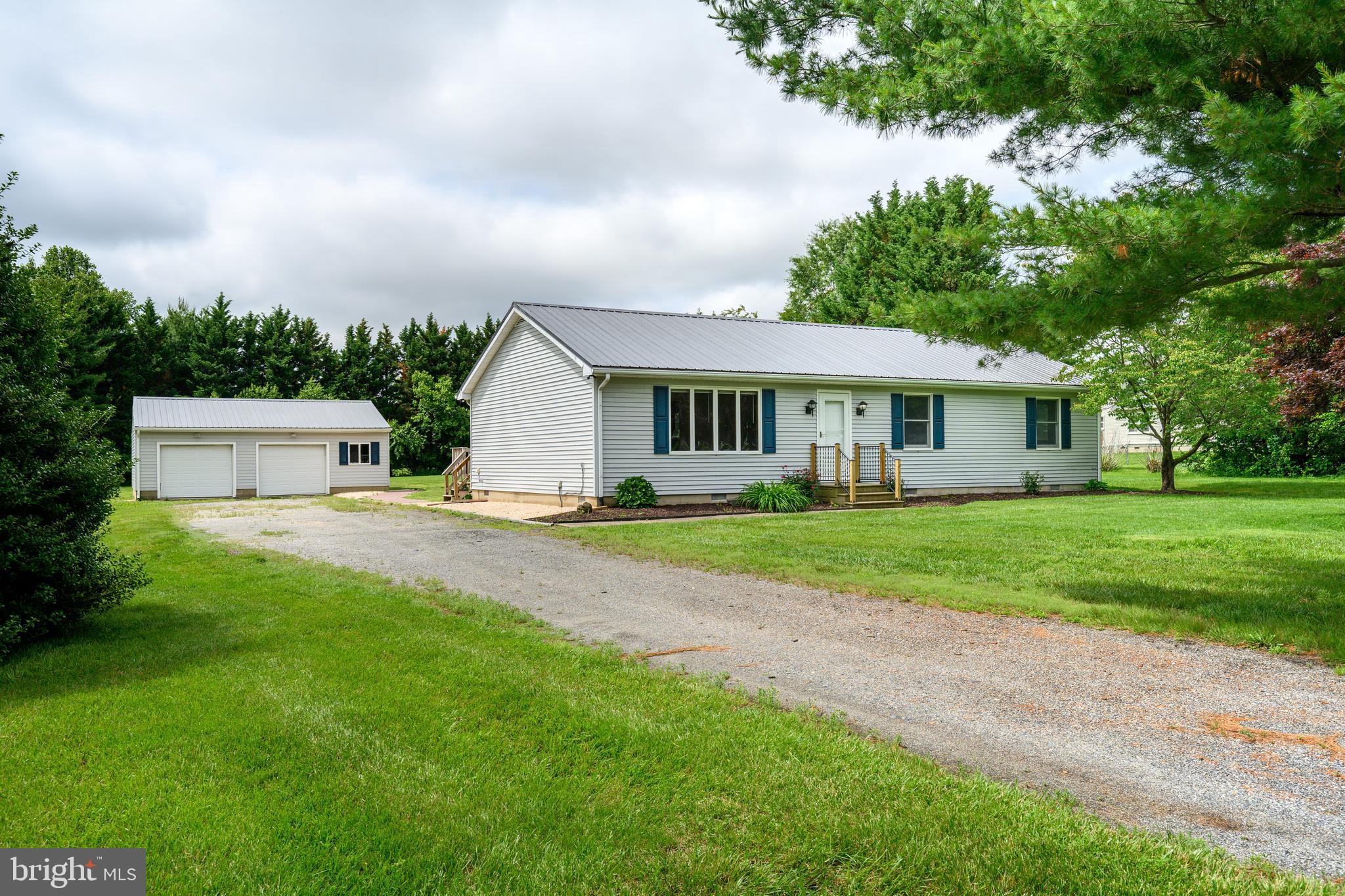 This is the type of house that so many are looking for. A great starter home or a place to downsize to one-level living, either way, this is the house and location. A style of home that is perfect for many. Offering a nice open kitchen and living room area, three bedrooms, and two full bathrooms. Mostly new or newer appliances, fresh paint, updated bathrooms. Separate utility room with entrance from back deck with new stackable washer/dryer and water treatment system. The house and detached oversized two-car garage has plenty of storage and work space, both have metal roofing. This home sits on 1.23 acres, which offers plenty of room to play and have hobbies, but not too much to care for. 31879 Mark Drive sits in a cul-de-sac, which is always a positive, and only minutes away from 301 to head north or south. A must-see if you're in the market. Great location, has been well cared for and move in ready. Just bring your style and make it your own.