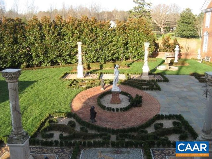 Charming quaint open concept living studio apartment overlooking European inspired gardens and manor house situated in the heart of Ivy; meticulously well maintained grounds. Beautiful brick designed structure with Buckingham slate roof. Very private and serene setting with an approximate 7 minute drive to Barracks Road, Stonefield Shopping Center, 12-15 minutes to UVA grounds and 1.5 miles to Foxfield Steeplechase.  Approximately 450 sf (upper level only) with additional storage space within the living quarters. Abundance of natural light. A beautiful crystal chandelier hangs in the entry to this timeless and classic structure.  Furnished and equipped with appliances, including washer/dryer; no dishwasher.  On site parking.  All electric, no gas, heat pump.  $1500 per month (deposit and 1st months rent).  $65 screening fee per person.  Month to month lease with 60 days notice to vacate.