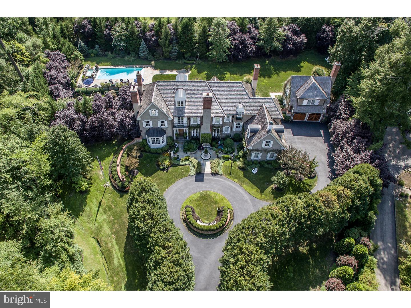This truly exceptional property offers the rarest combination of exquisite custom construction by one of the Main Line's most respected builders, with a breathtaking private lot in Radnor's most prestigious neighborhoods, complete with stunning pool, expansive terraces, gardens and Carriage House. Finely crafted features include beautiful architectural designs, millwork and moldings, 10 ft ceilings, sun filled windows, gracious room sizes with a wonderful open flow and timeless finishes throughout, 6 indoor and 2 outdoor fireplaces, front to back entrance foyer with views of the glorious grounds, incredible Gourmet Kitchen with 8 burner gas Wolf cooktop, double Wolf ovens and two 48" Subzero refrigerator and freezer with additional drawers, fabulous Master Suite with sitting area, 4 additional bedroom suites with custom baths on the second floor and a separate 1 bedroom Carriage House apartment, finished Lower Level with Media Room and Gym and easily finished third floor. Move right in and enjoy the convenience of being close to all renowned schools, trains, walk to the Radnor Trial, restaurants and just minutes from Center City Philadelphia and the airport. A real treasure.