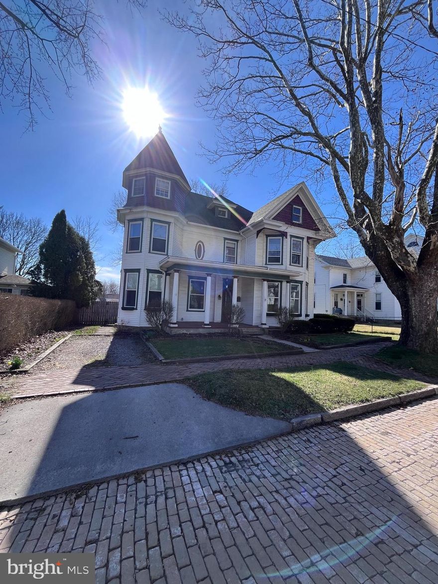 This is a rare find! Located on historic Frost Avenue within minutes of walking distance to downtown Frostburg and FSU,  this  Beautiful Victorian Home boasts a rare blend of original features with updated kitchen and bathrooms.  Featuring a corner tower, bay windows, hardwood floors, pocket doors, dual staircases and so much more, it's a must see. The third floor/attic allows for a very large storage space or more space to finish and add more rooms. Large fenced level rear yard.
