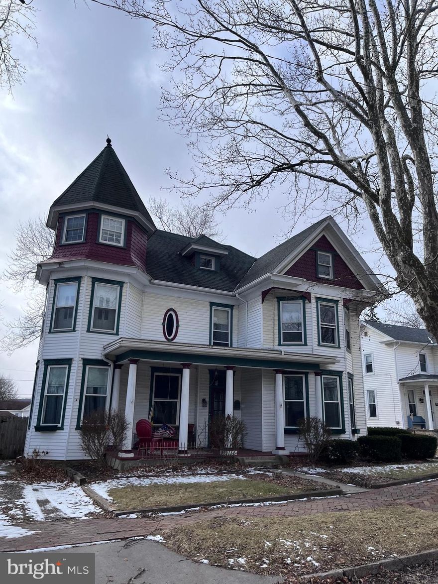 This is a rare find! Located on historic Frost Avenue within minutes of walking distance to downtown Frostburg and FSU,  this  Beautiful Victorian Home boasts a rare blend of original features with updated kitchen and bathrooms.  Featuring a corner tower, bay windows, hardwood floors, pocket doors, dual staircases and so much more, it's a must see. The third floor/attic allows for a very large storage space or more space to finish and add more rooms. Large fenced level rear yard.