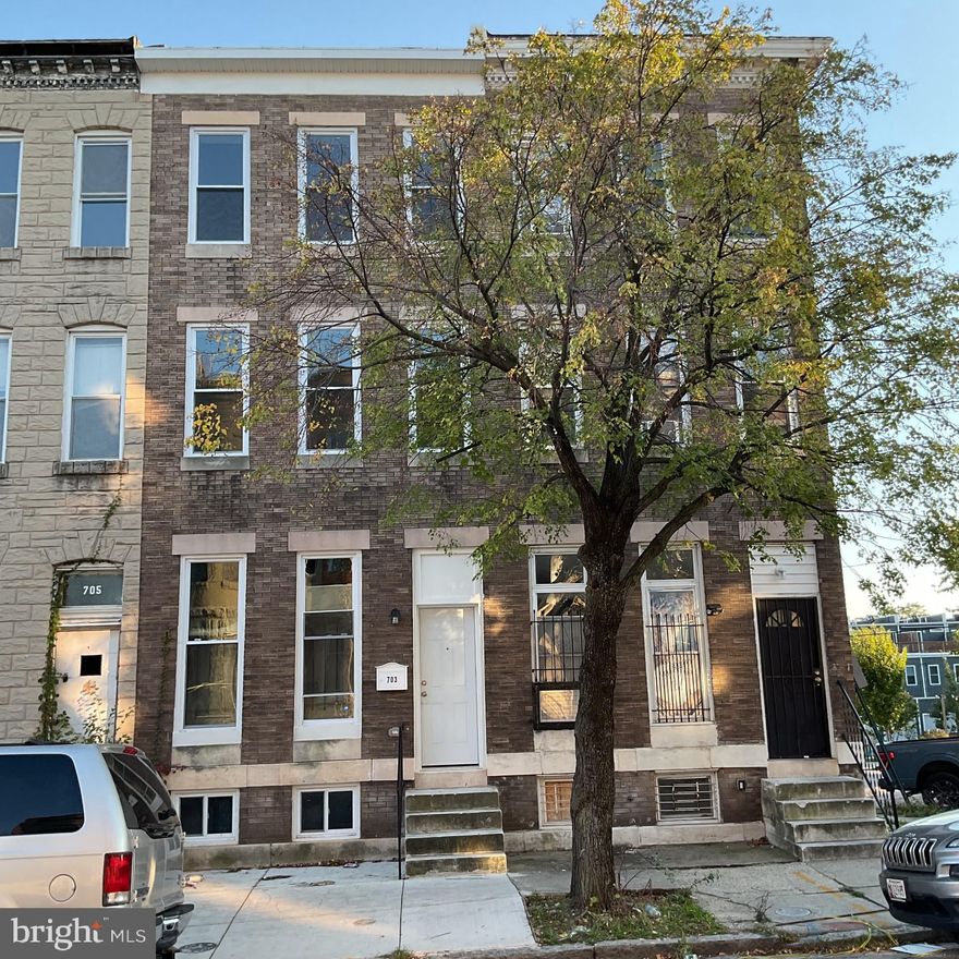 Come and take a look this potentially 4 bedroom 3 Full Bathrooms and 1 half Bathroom all Brick Colonial Rowhouse.  It is fully renovated from top to bottom, the basement up to the Main Level, the  Upper Level 1 and Upper Level 2 on the top floor. It comes with all new appliance, a partially finished basement with a full bath, and extra space in the basement for storage or other personal use.  It is located in the up and developing  East Baltimore Midway Neighborhood. People are  buying, renovating and moving in.  Along with its ample space, this three level carpeted Townhouse comes with a Deck, overlooking a little neighborhood park, and a rear private parking pad which provides an Off -Street Parking advantage, especially during the winter snowy months. Walk from the basement right to your vehicle parked in your OWN Parking Space.