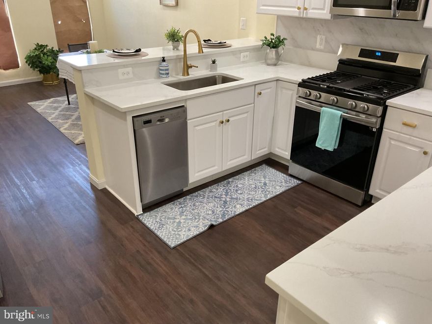 Come and take a look this potentially 4 bedroom 3 Full Bathrooms and 1 half Bathroom all Brick Colonial Rowhouse.  It is fully renovated from top to bottom, the basement up to the Main Level, the  Upper Level 1 and Upper Level 2 on the top floor. It comes with all new appliance, a partially finished basement with a full bath, and extra space in the basement for storage or other personal use.  It is located in the up and developing  East Baltimore Midway Neighborhood. People are  buying, renovating and moving in.  Along with its ample space, this three level carpeted Townhouse comes with a Deck, overlooking a little neighborhood park, and a rear private parking pad which provides an Off -Street Parking advantage, especially during the winter snowy months. Walk from the basement right to your vehicle parked in your OWN Parking Space. Some photos are staged.