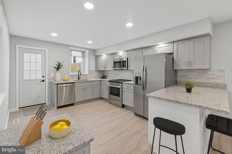 Fully renovated and move-in ready, this beautifully updated home features modern finishes throughout, including an open-concept layout, sleek iron railings, wide-plank flooring, and a stylish kitchen with brand-new stainless steel appliances, granite countertops, and shaker-style cabinetry. The basement offers clean storage space and a full laundry area, while upstairs includes spacious bedrooms, a tiled bathroom with a skylight, and great natural light. Out back, enjoy a brand-new deck and private yard perfect for relaxing or entertaining. Ideally located just off I-95, you're minutes from Center City’s business district and cultural destinations, and close to all the energy and attractions along Richmond Street, Fishtown, and Northern Liberties—known for their top-rated restaurants, bars, cafes, galleries, and boutique shopping. With public transit, parks, and everyday conveniences nearby, this is a prime opportunity for both homeowners and investors looking for value and lifestyle. Some photos are virtually staged.